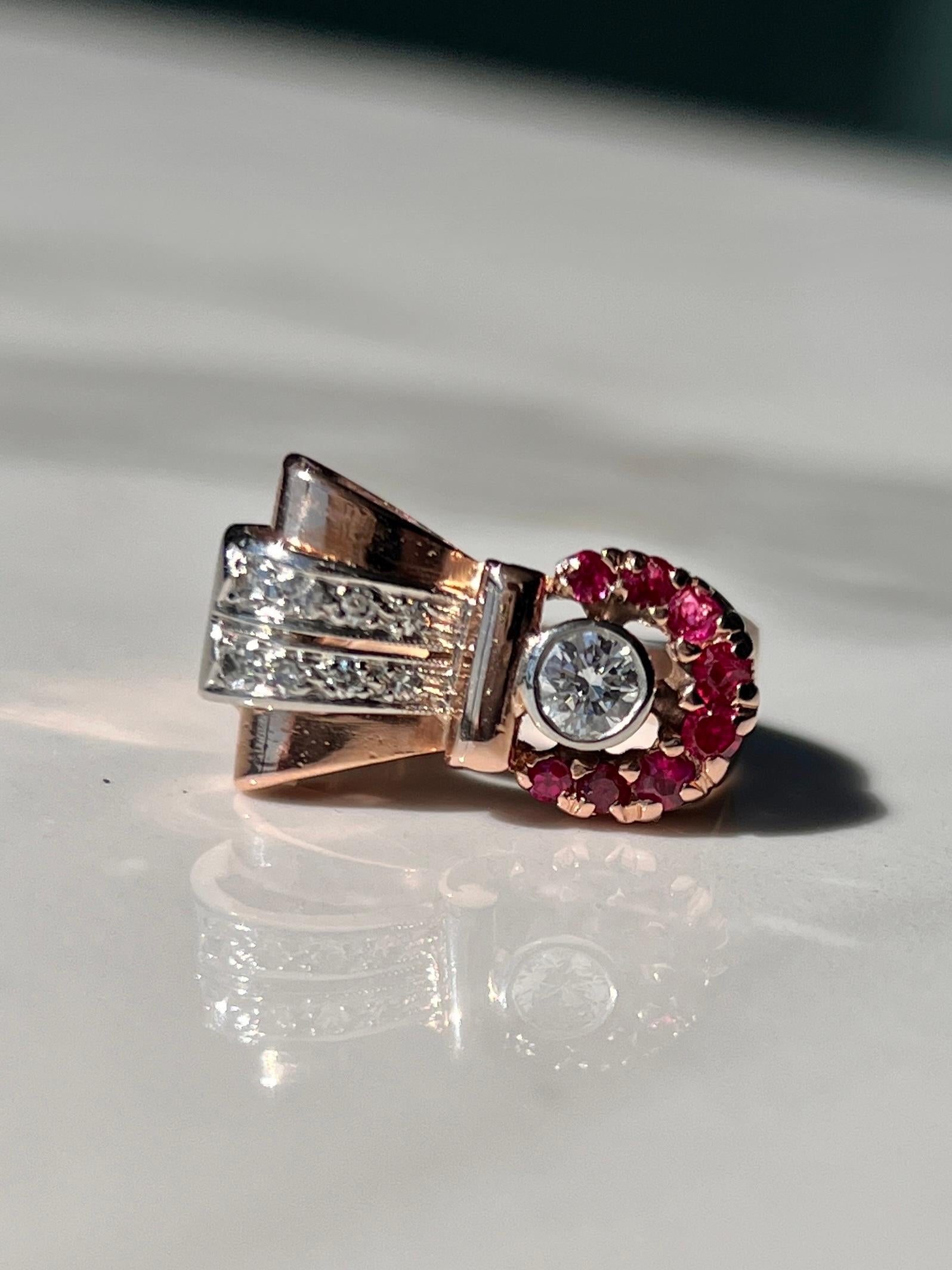 The classic style of Circa 60-70''s was this round ruby and diamond bow style cocktail ring. Handmade in solid rose gold and set with natural rubies & diamonds.

This is an authentic bespoke vintage piece and cannot be recreated.

Material: 14kt