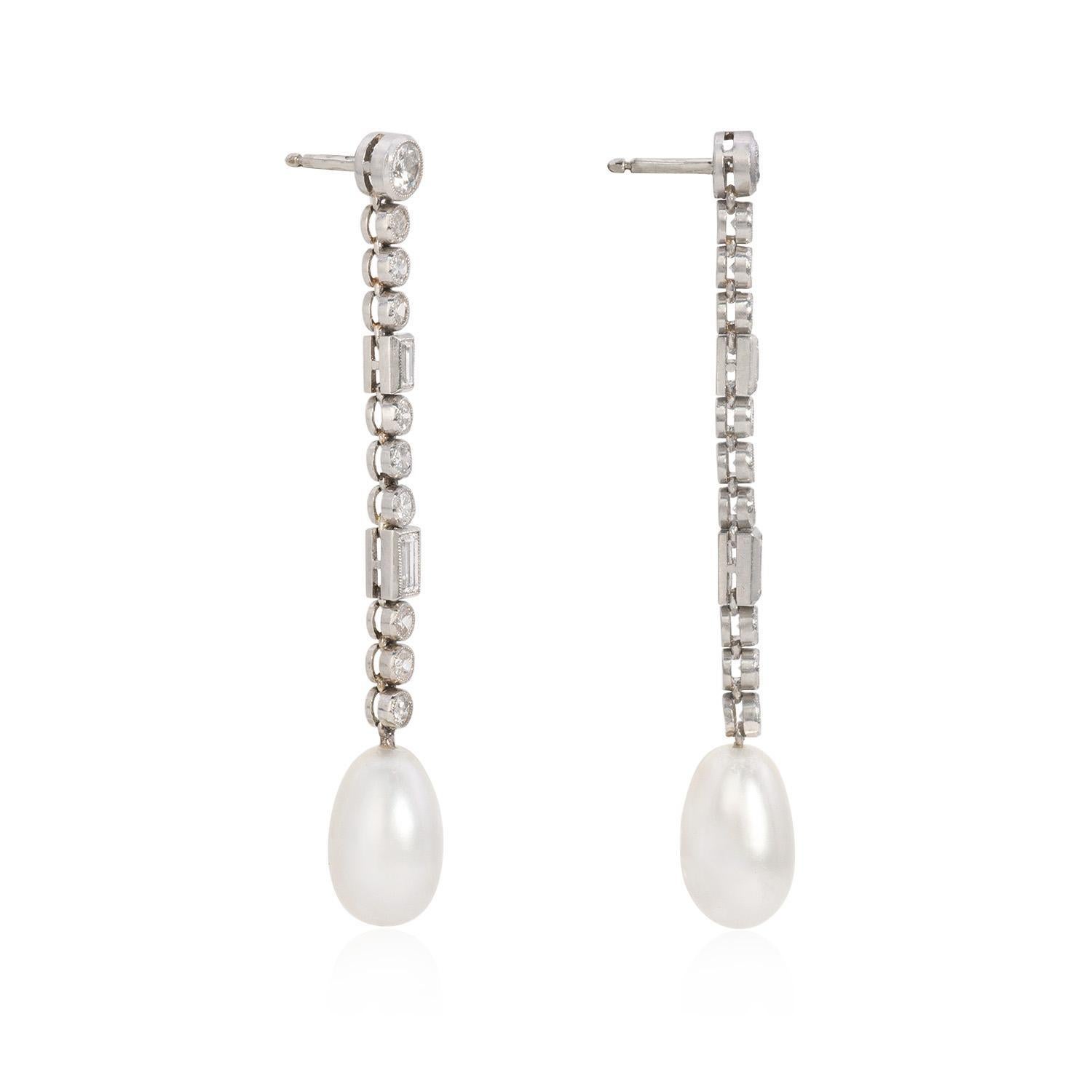 Wrapping up the elegant design of these Natural Art Deco Saltwater Pearl Earrings. 

Crafted with meticulous attention to detail, these earrings showcase a stunning natural pearl measuring 13.8mm by 8.5mm, gracefully suspended from the earlobe. The