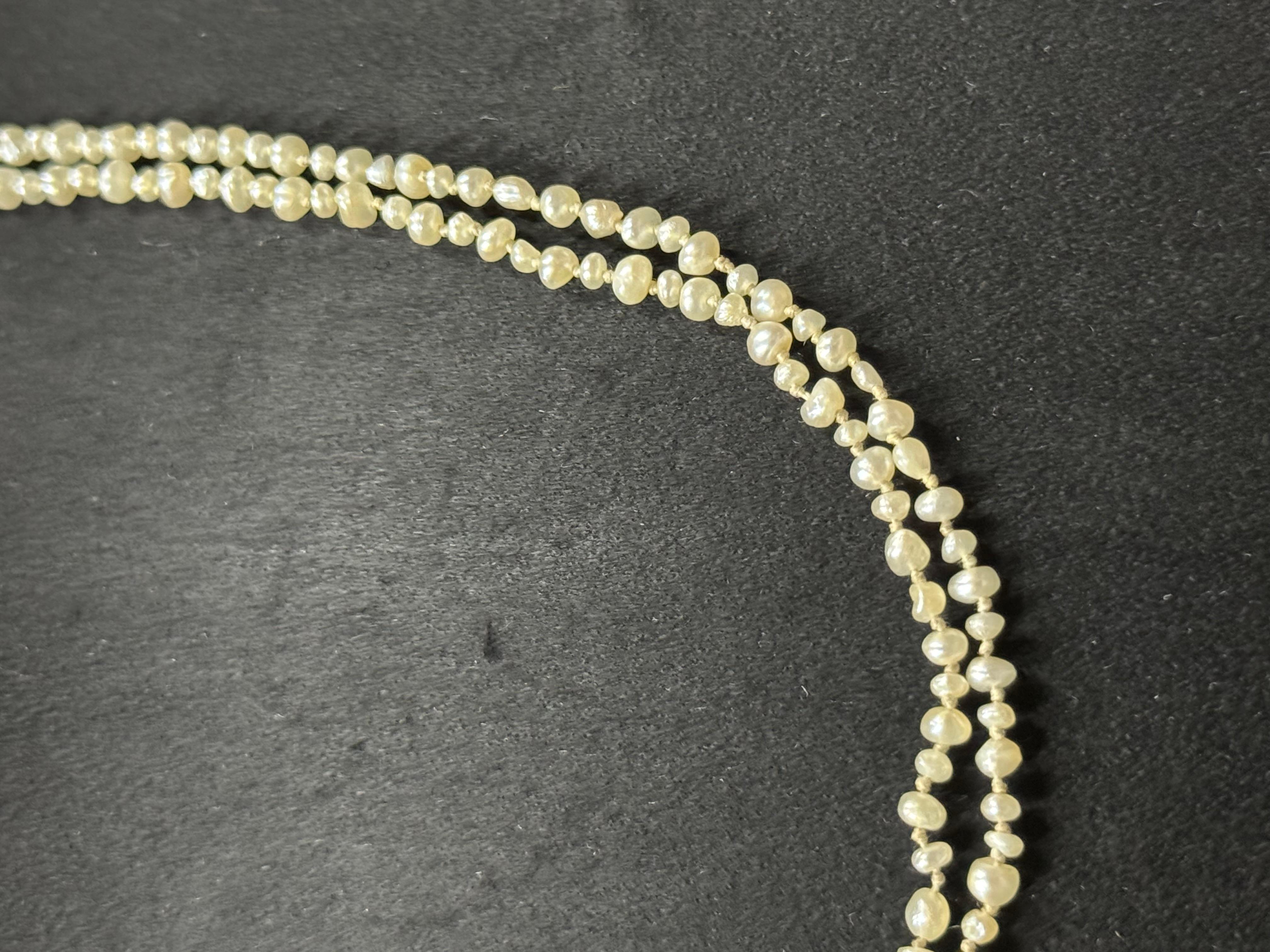 
This beautiful necklace is crafted with natural saltwater pearls and a yellow gold metal. The pearls are carefully selected to ensure their quality and are strung together to create a stunning piece. The necklace is perfect for those who appreciate