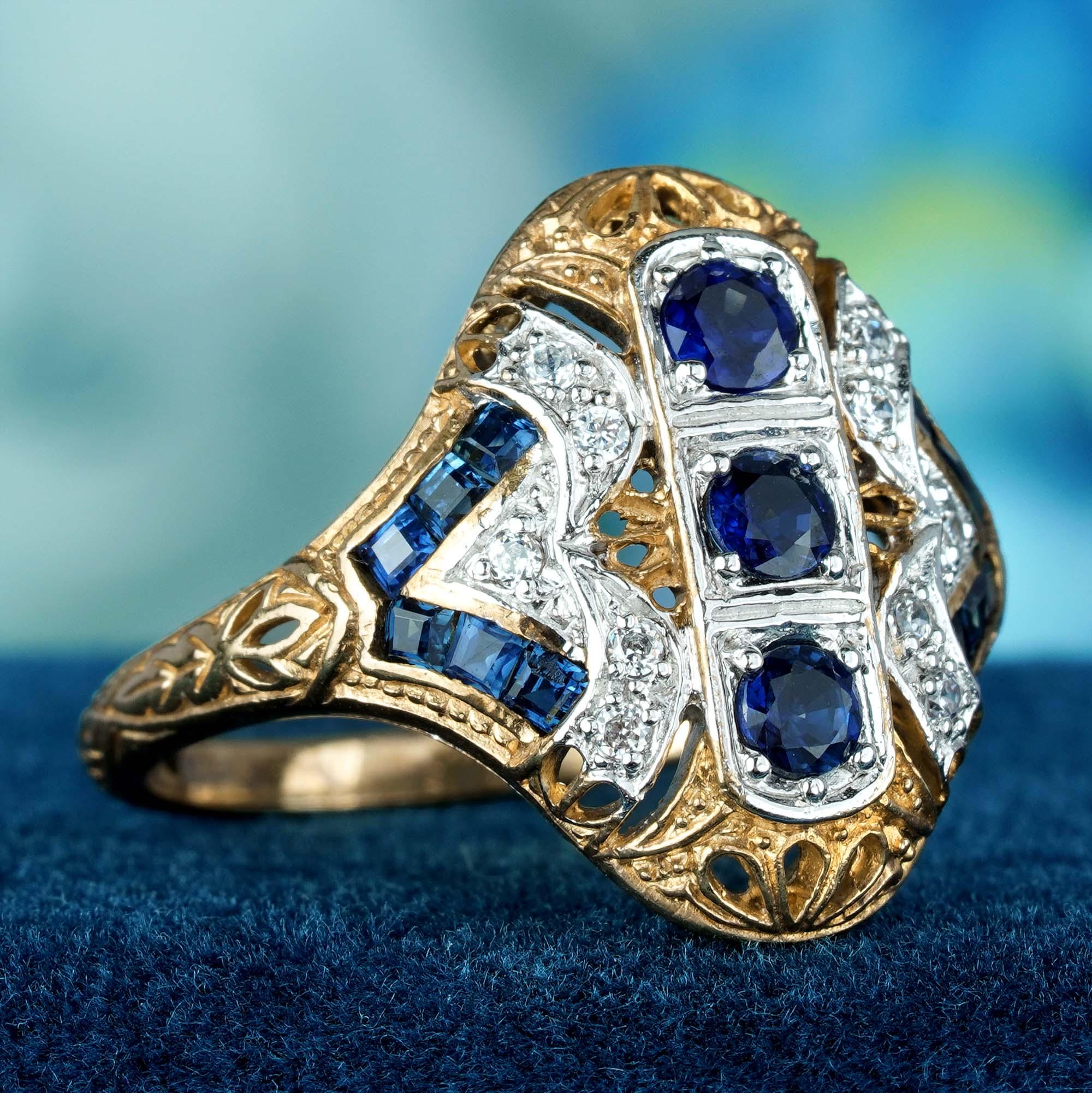 This Art Deco vintage-style ring. It features a central 3 cascading cluster of round blue sapphire set in a raised prong set, with delicate filigree work adorning the solid two tone gold adds a touch of romance to the ring. The sapphires are flanked