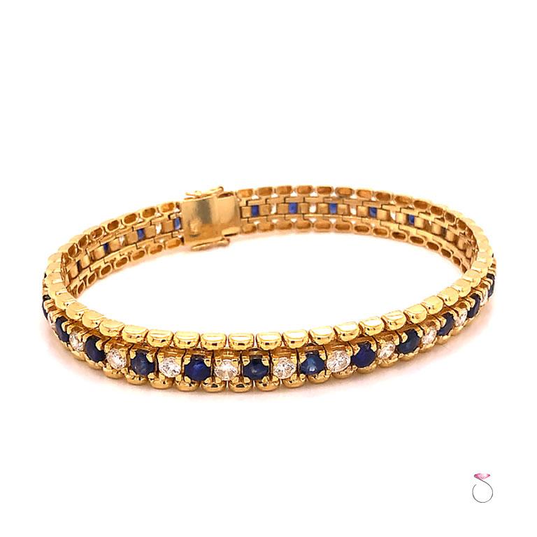 This stunning tennis bracelet is absolutely beautiful, made in 18k yellow gold with 26 round natural blue sapphires and 26 round brilliant cut diamonds. The Sapphires and diamonds alternate all around creating a beautiful contrast and each is set in