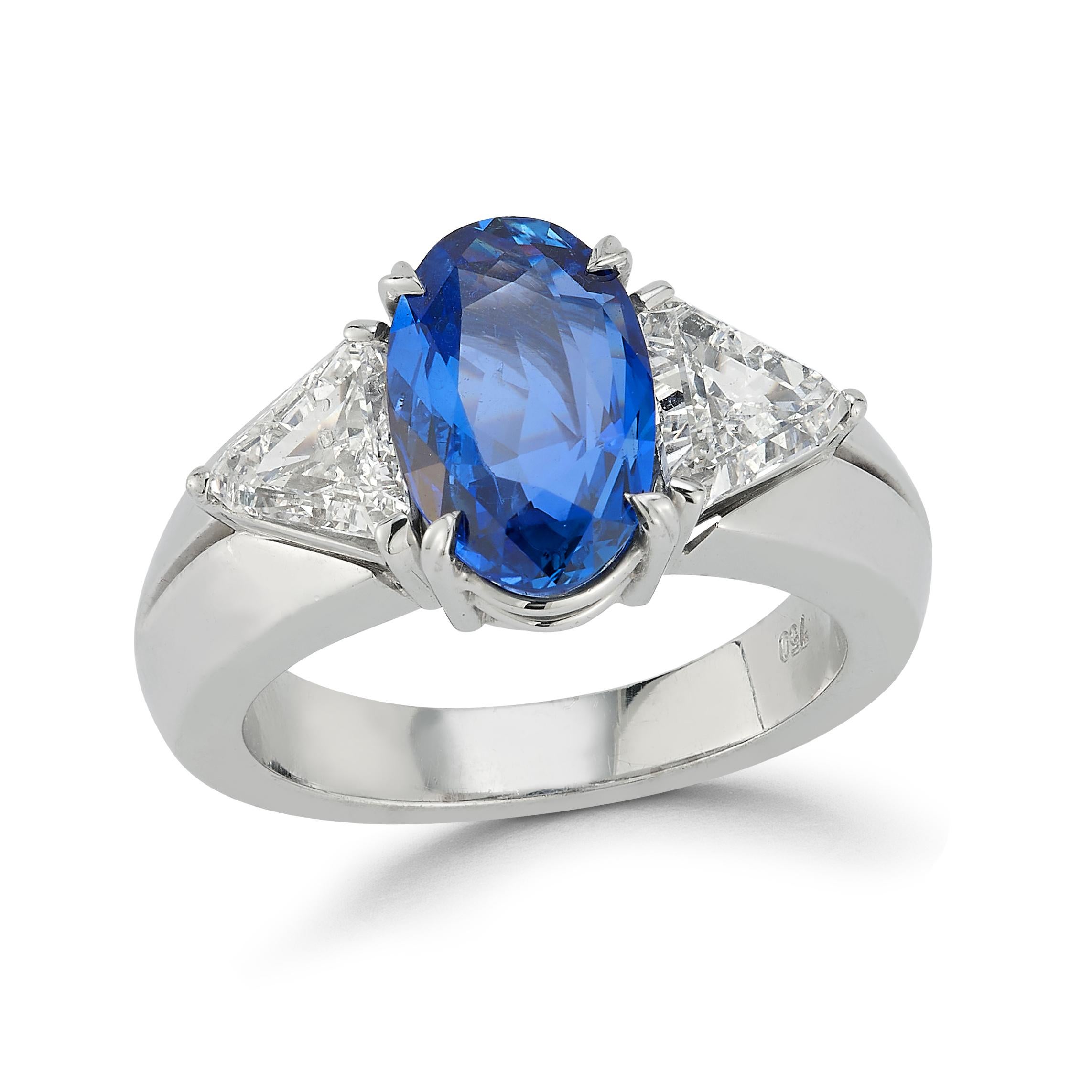 Unheated Sapphire & Diamond Three Stone Ring

An 18 karat white gold ring set with a natural modified oval cut sapphire flanked by 2 trillion cut diamonds
Approximate Sapphire Weight: 3.69 carats
Approximate Total Diamond Weight: 1.2