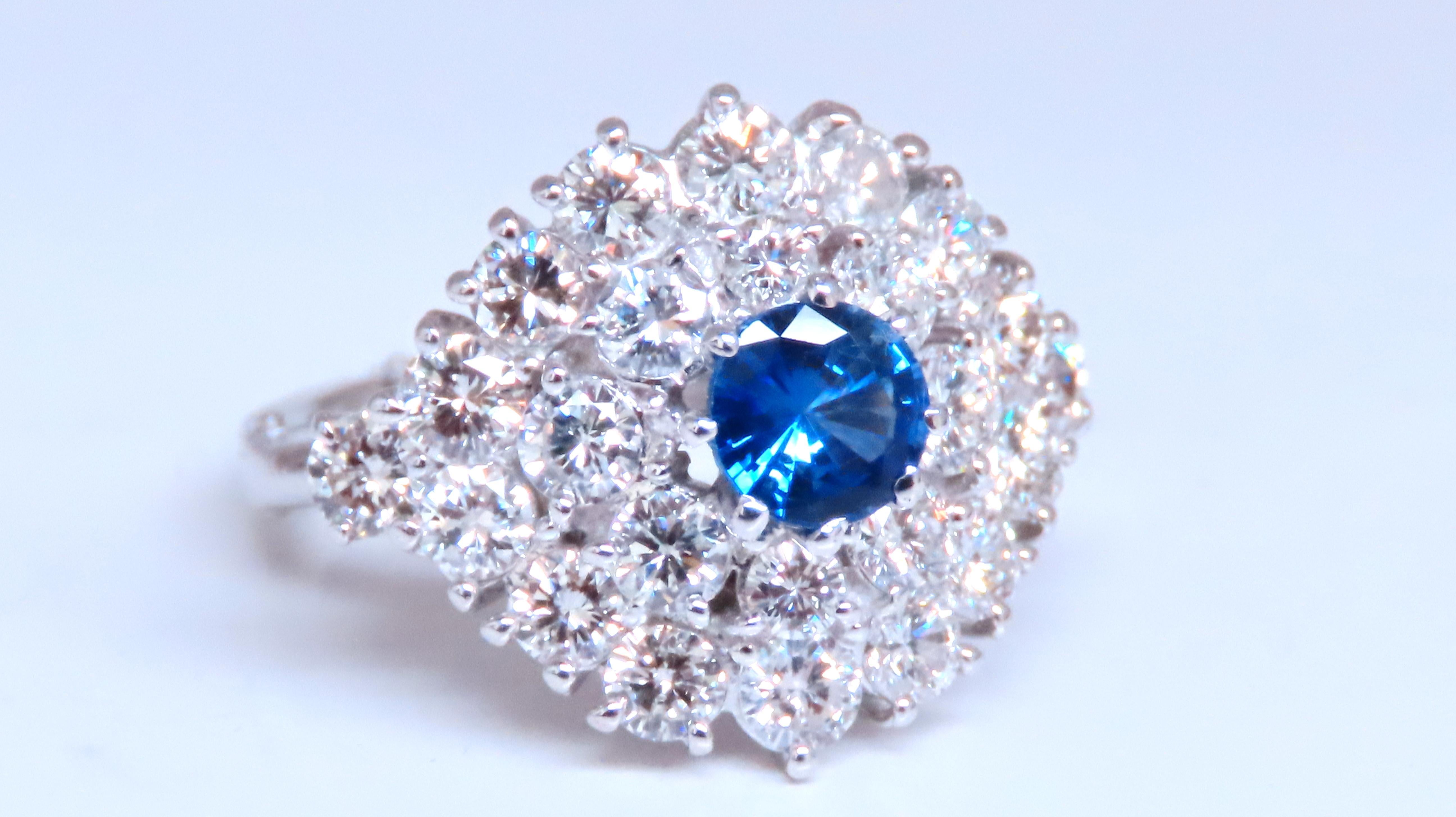 .70ct Natural Sapphire Ring.
Round, full cut briilliant.
5.4mm diameter.
Heated

2.40ct Natural Side round diamonds.
G-color Vs-2 clarity.

14kt white gold. 
Item: 6.8 grams.
Deck: 16.6mm
DEpth 12mm

Current Size: 6
May slip over large knuckle and