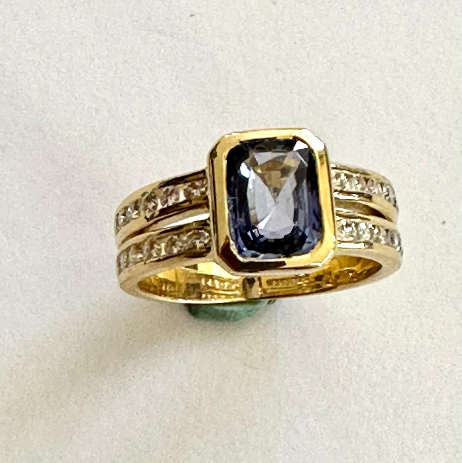 An 18K. yellow gold ring set with a sapphire and 24 brilliant cut diamonds.
Sapphire: 2.13 ct. Cuchion cut Color: Violet Blue. No indication of heating.
24 brilliant cut diamonds total weight: 0.50ct VSI-G.
Ring was made in the Netherlands around