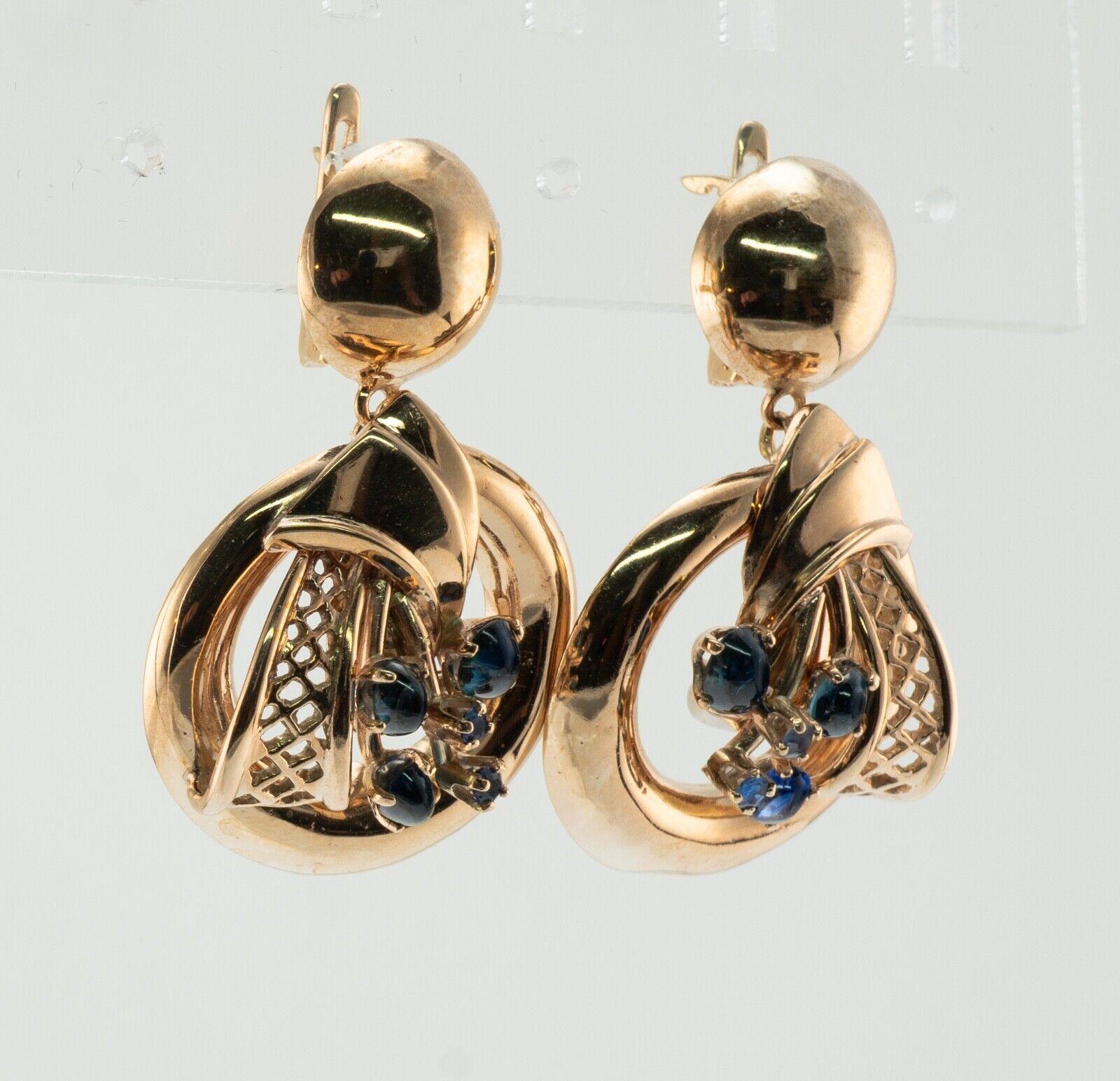 Natural Sapphire Earrings Drop Dangle 14K Gold Vintage

This vintage pair of earrings is crafted in solid 14K Yellow Gold (carefully tested and guaranteed). Each earring holds three natural sapphire cabochons and two round cut sapphires. These gems