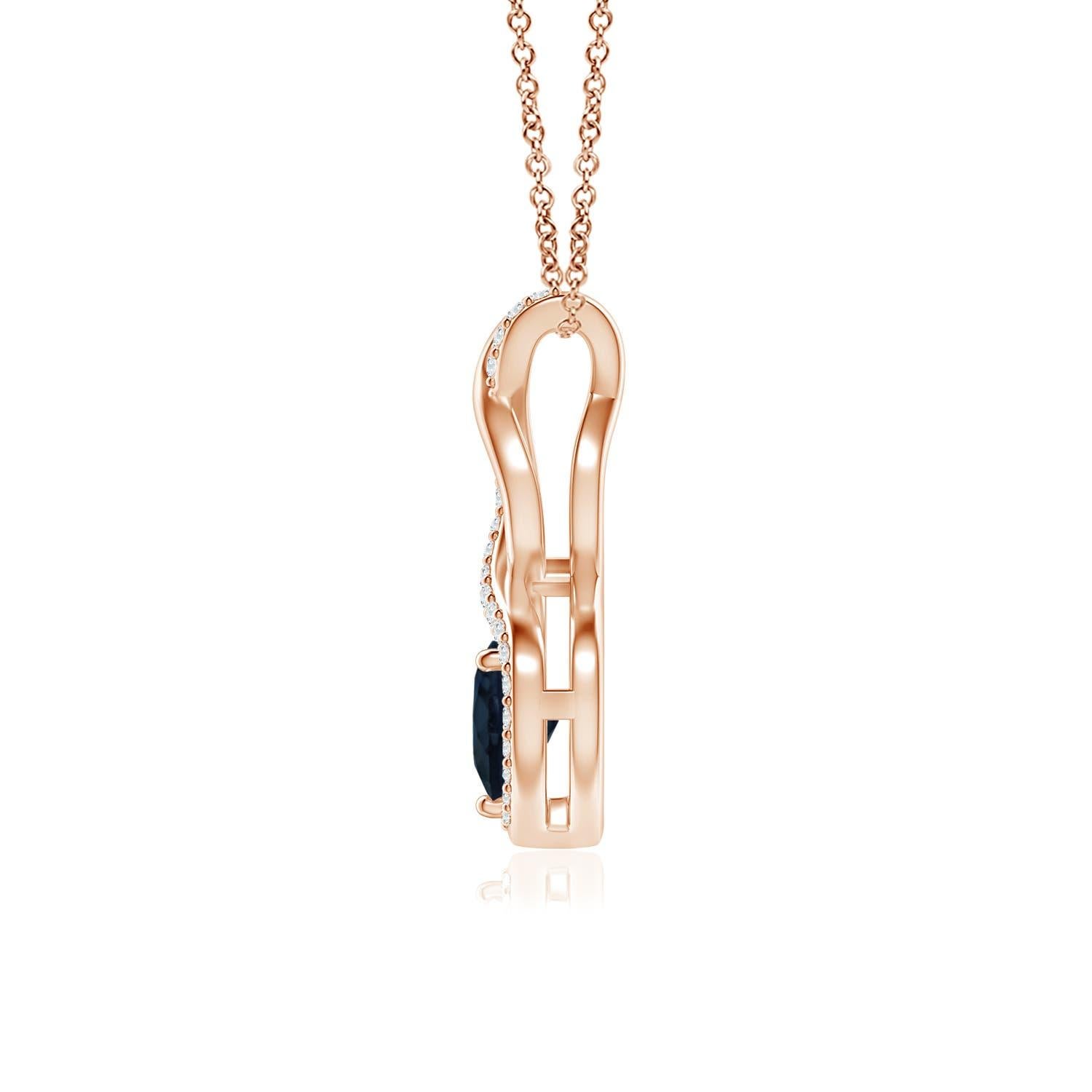A diamond studded strip entwines with a lustrous metal strip to form an ornate infinity. Floating amid the graceful infinity is a beautiful heart-shaped blue sapphire in a prong setting. The sparkling diamonds infuse a captivating edge to this 14k