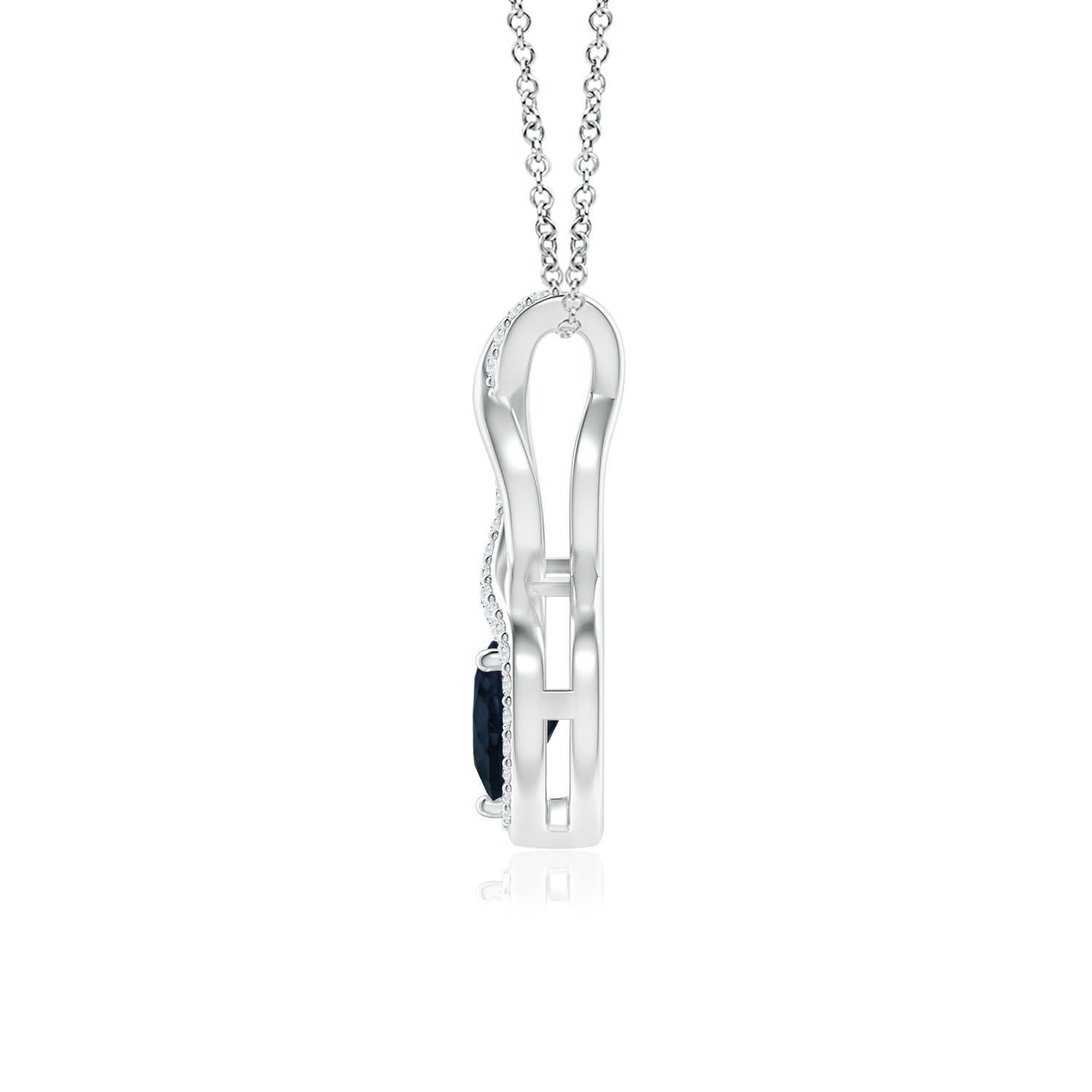 A diamond studded strip entwines with a lustrous metal strip to form an ornate infinity. Floating amid the graceful infinity is a beautiful heart-shaped blue sapphire in a prong setting. The sparkling diamonds infuse a captivating edge to this 14k
