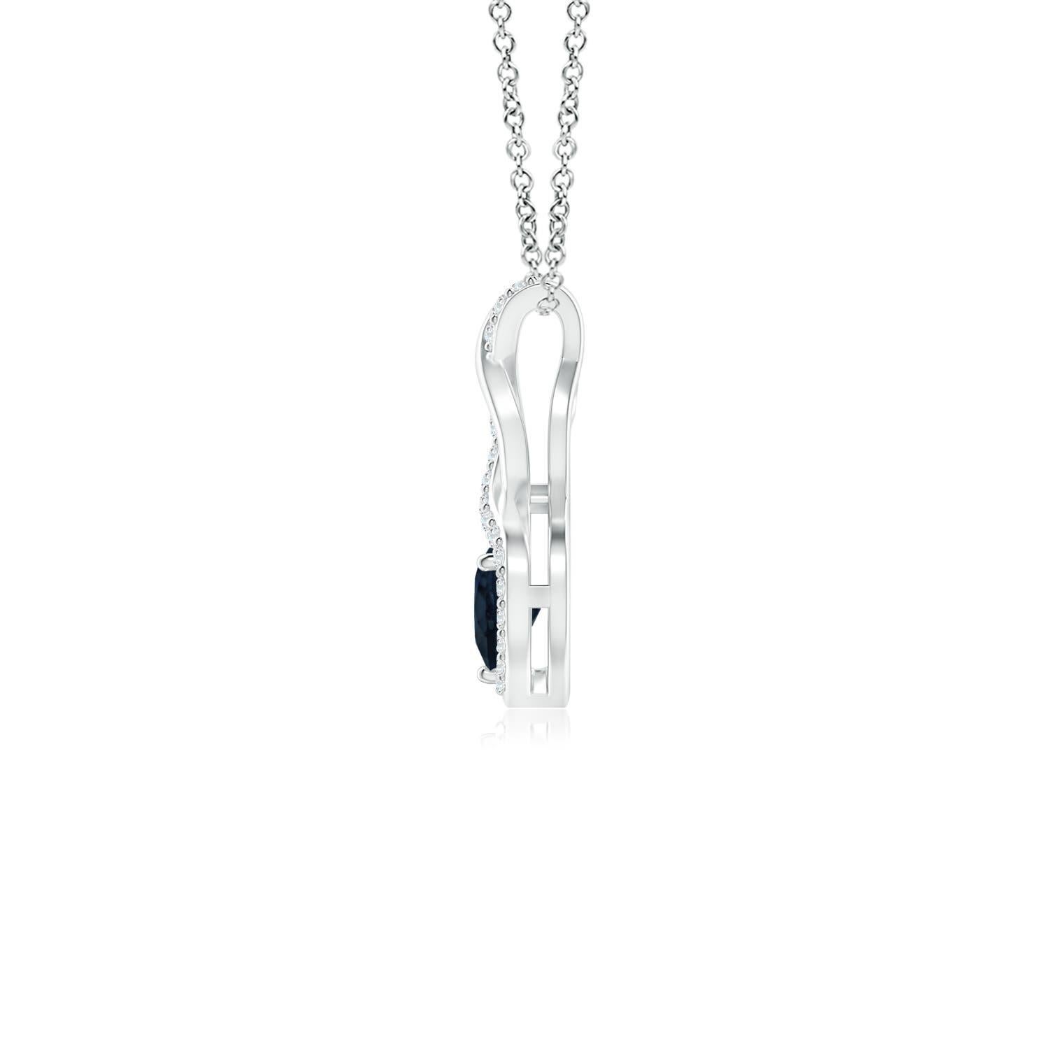 A diamond studded strip entwines with a lustrous metal strip to form an ornate infinity. Floating amid the graceful infinity is a beautiful heart-shaped blue sapphire in a prong setting. The sparkling diamonds infuse a captivating edge to this 18k