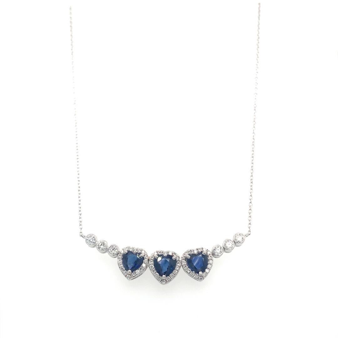 An 18-karat white gold necklace set with a natural 1.53-carat heart-shaped sapphire and 0.45-carat diamonds surrounding it. 