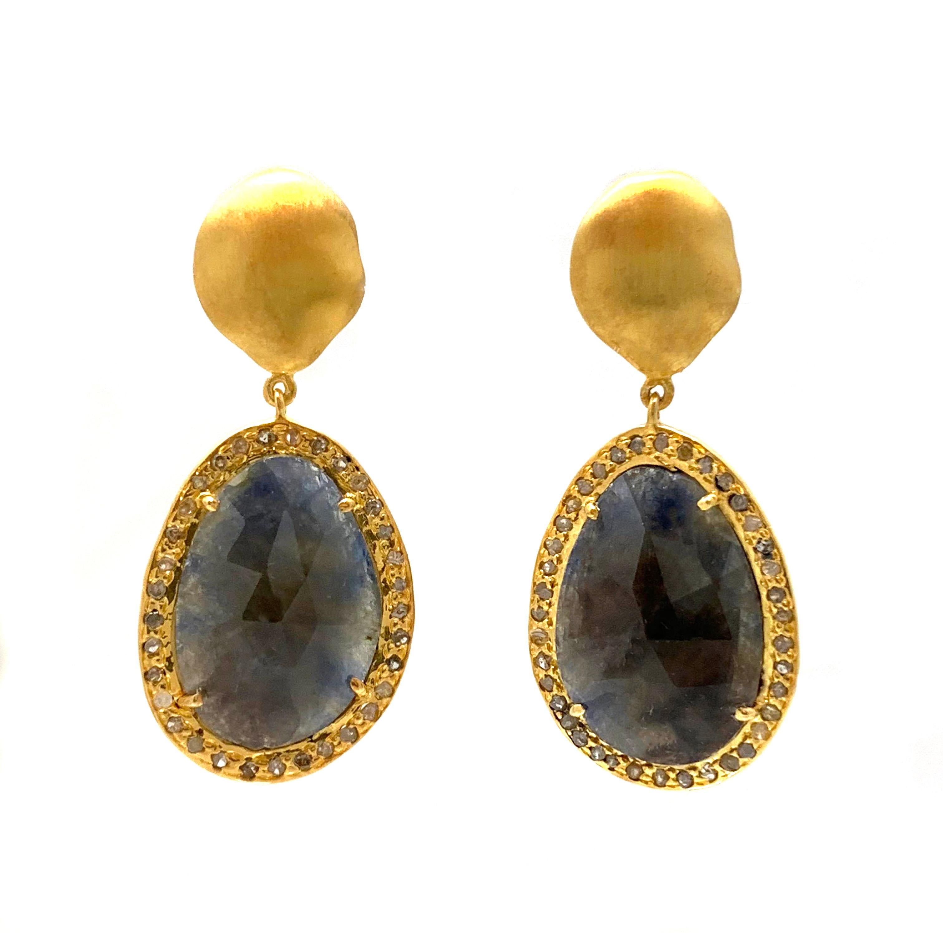 Natural Sapphire with Rough Diamond Drop Vermeil Earrings

These beautiful pair of one of a kind earrings feature a pair of sparkly fancy-shape rose-cut natural Indian sapphire, surrounded with rounds rough diamond, hand-set in sterling silver with
