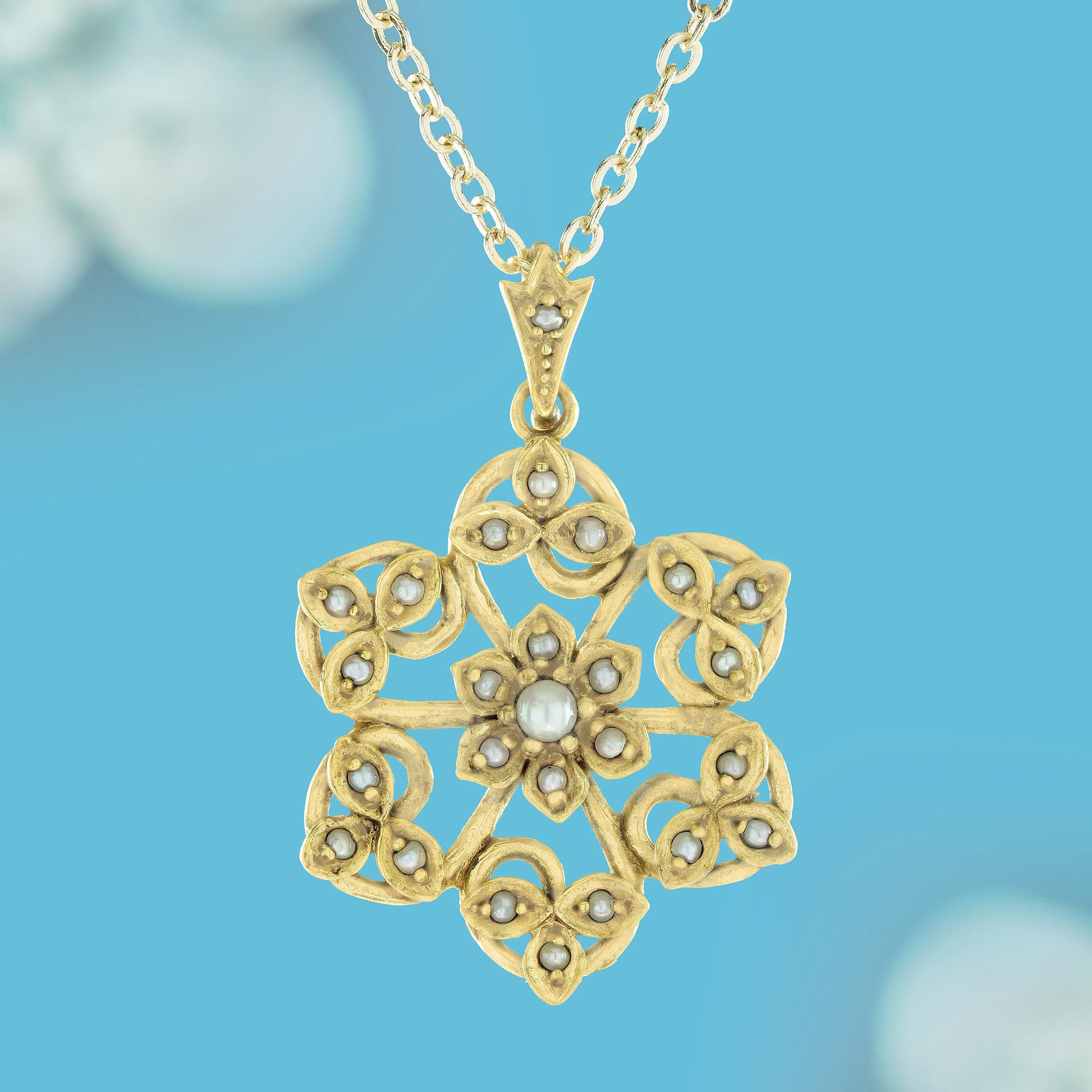 Crafted from yellow gold, this elegant vintage-style floral pendant evokes sophistication with its intricate swirling loops and curves reminiscent of blooming flowers. At its center lies a round white pearl, resembling the delicate pollen of a