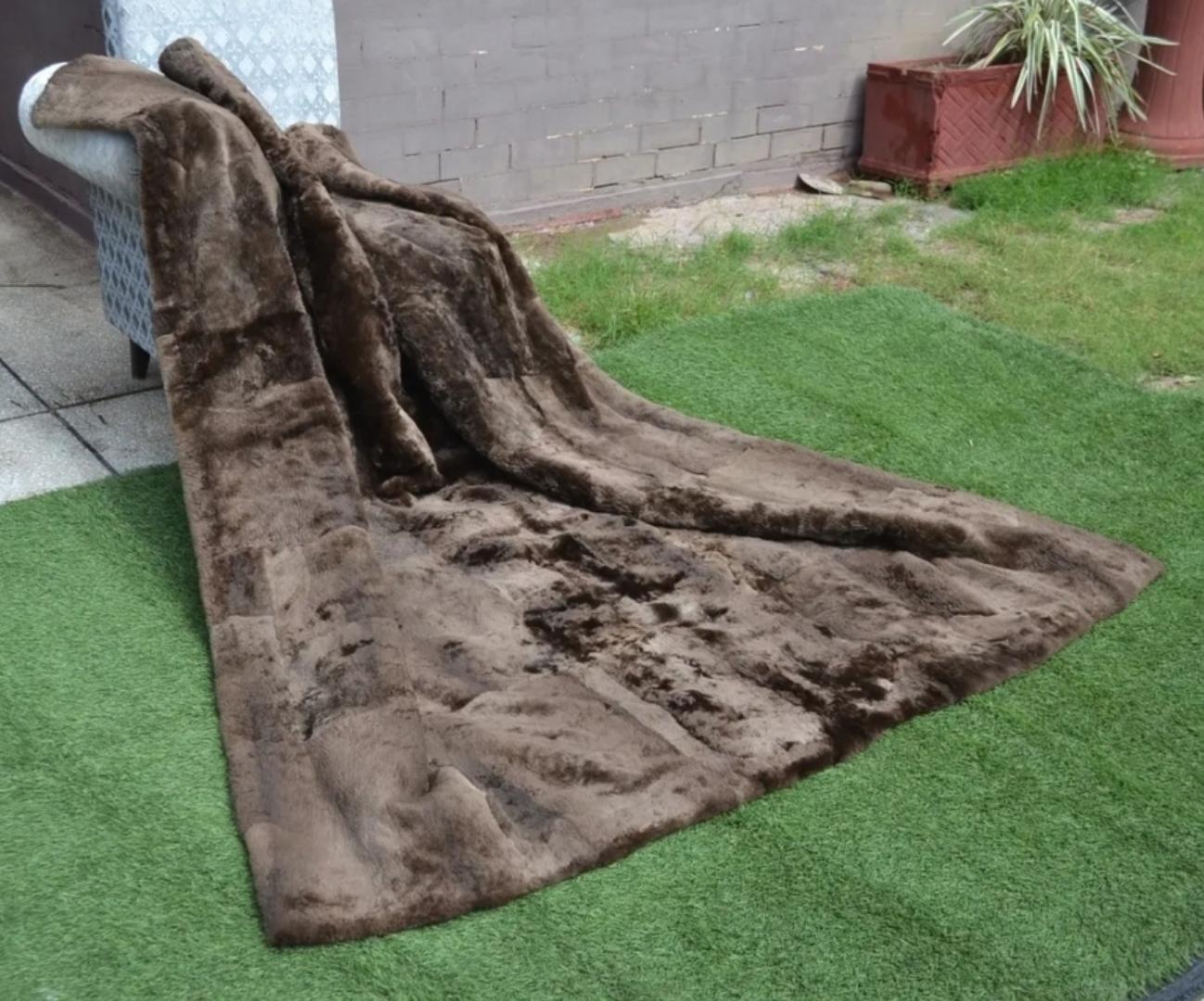 This is a beautiful and luxurious sheared beaver king size blanket.
Soft pelts with a rich medium brown color, accented with black backing.
This is perfect for a bed or just for sitting under on the couch. 
Shipping in the continental USA is $69