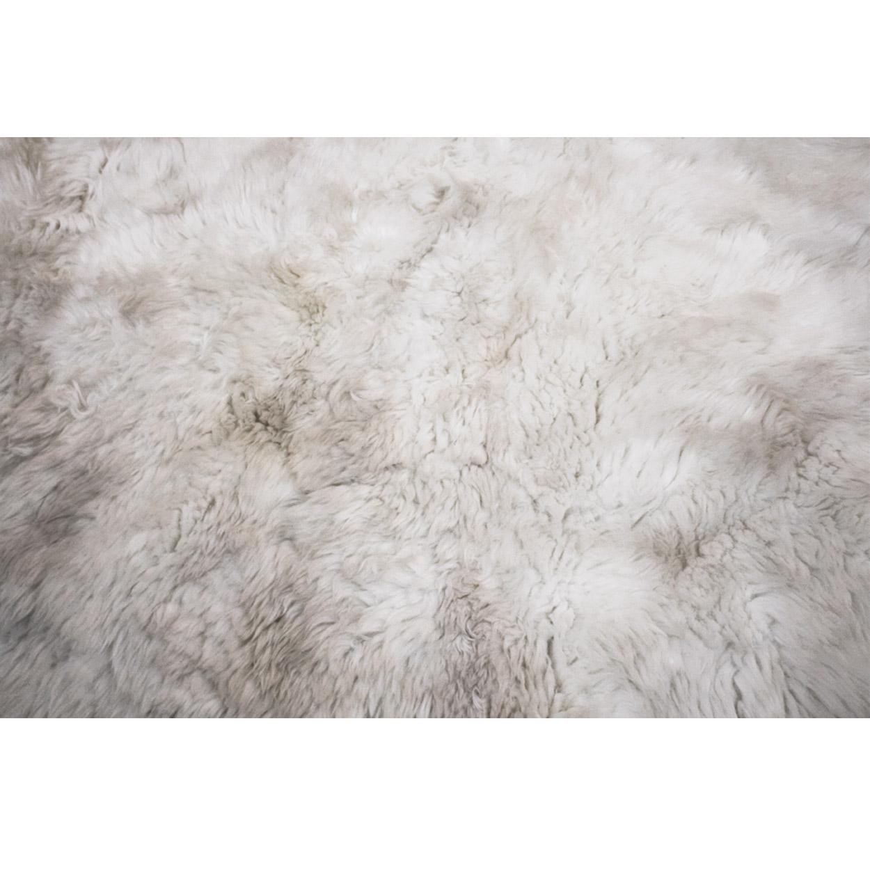 Natural sheep hair pile rug.

Measurements: 240 x 220 cm