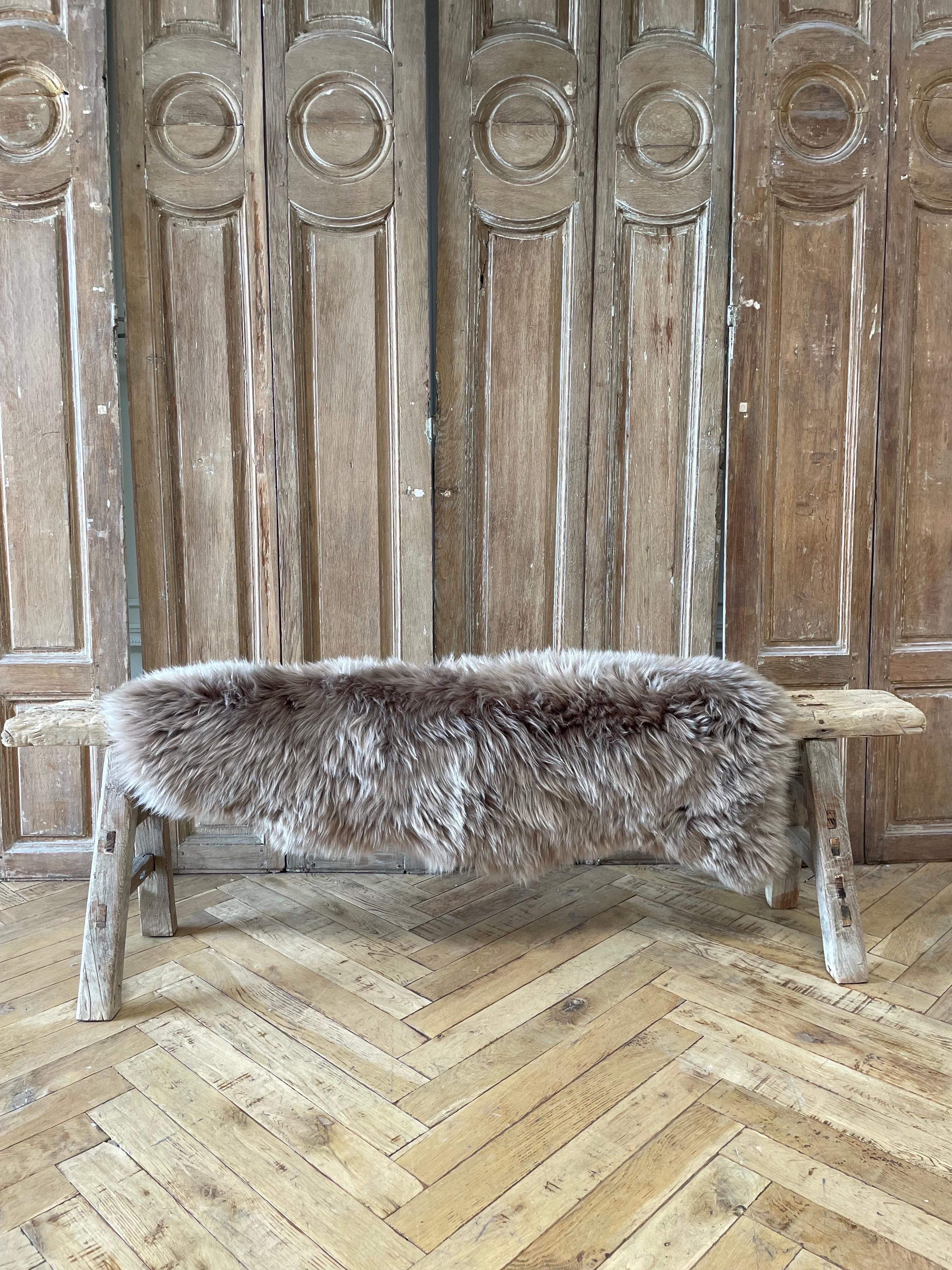 Natural sheep skin 
origin: paris france
Size at widest points : 45” x 31” / shortest width 23”
Center to Center of skin 41” x 26”
A gorgeous dark mocha taupe gray long hair. Perfect for use over a bench, or as a rug.