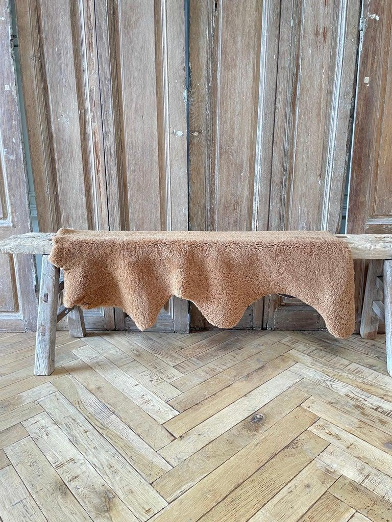 Natural chocolate brown colored sheepskin 
natural hide can be used as a rug, or throw over a chair or bench
Size: 39” x 29” 
17