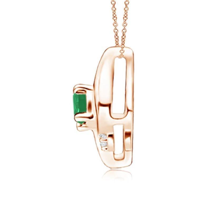 This gorgeous pendant features an alluring conch-like frame that holds a lush green emerald. Sparkling round diamond accents add to the overall allure of the design. This oval emerald and diamond pendant is designed in enduring 18k rose gold.