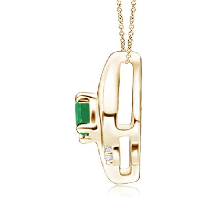 Ce magnifique pendentif présente un cadre en forme de conque qui renferme une émeraude d'un vert luxuriant. Des diamants ronds étincelants ajoutent à l'allure générale du modèle. Ce pendentif ovale en émeraude et diamant est conçu en or jaune 18k