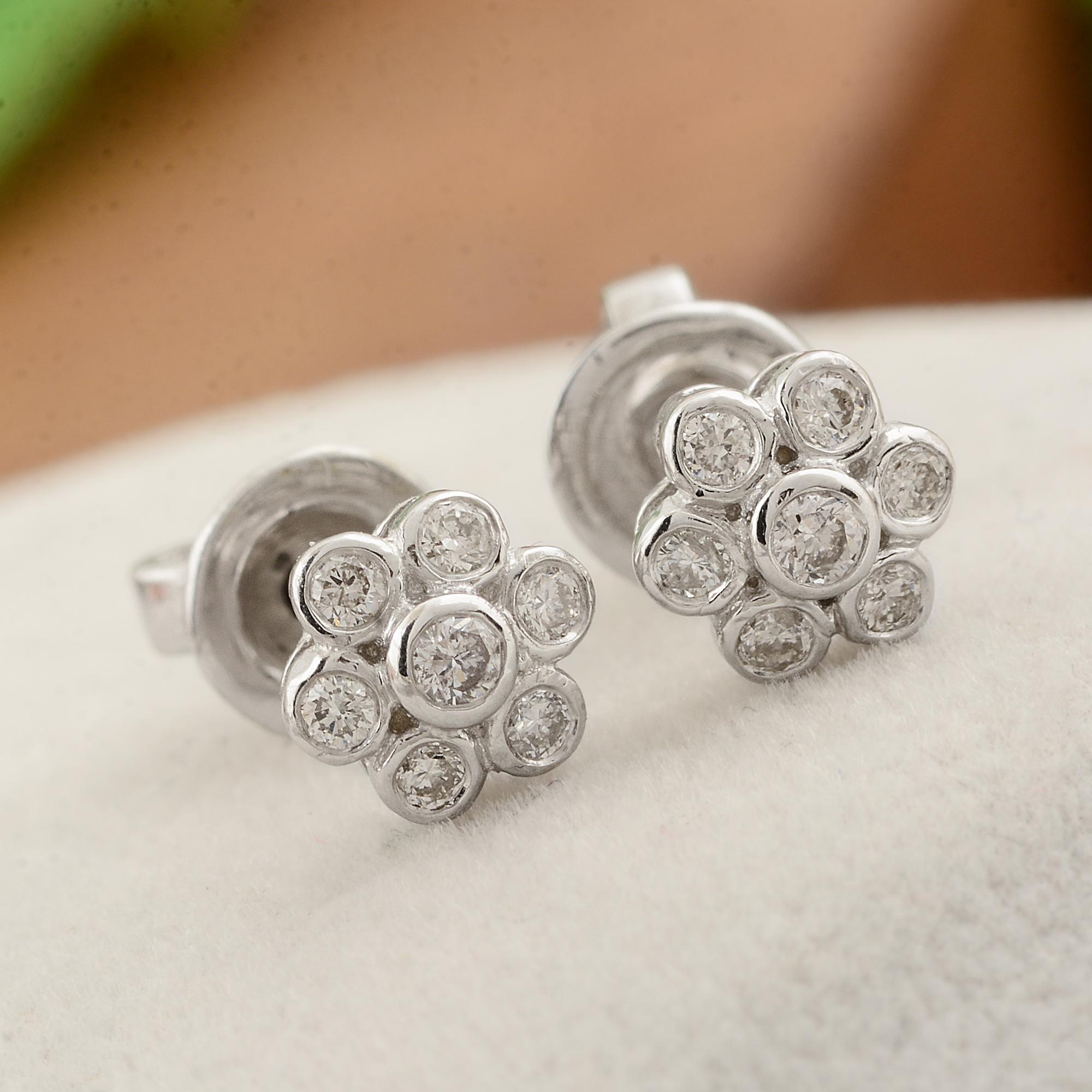 Elevate your ensemble with the enchanting beauty of these Natural SI Clarity HI Color Diamond Flower Stud Earrings, delicately crafted in lustrous 10 Karat White Gold. These exquisite earrings are a celebration of nature's beauty and timeless