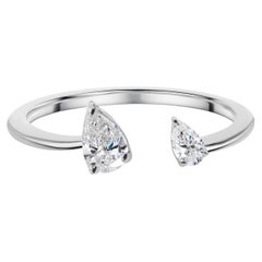 Anillo puño abierto de oro blanco de 18 quilates con dos piedras de diamante pera SI/H natural