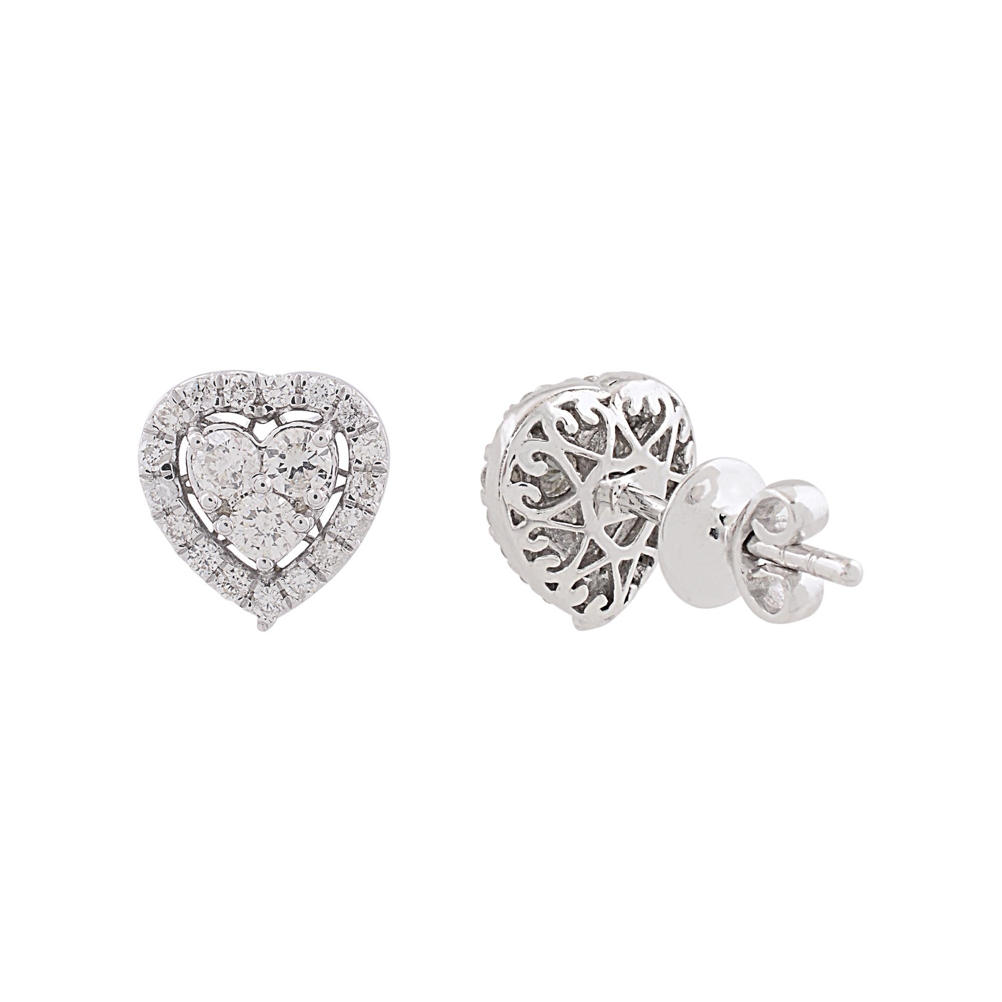 Indulge in a timeless symbol of love and elegance with these exquisite Natural SI/HI Round Diamond Heart Stud Earrings, crafted in lustrous 10 Karat White Gold. These charming earrings are a celebration of romance and sophistication, designed to