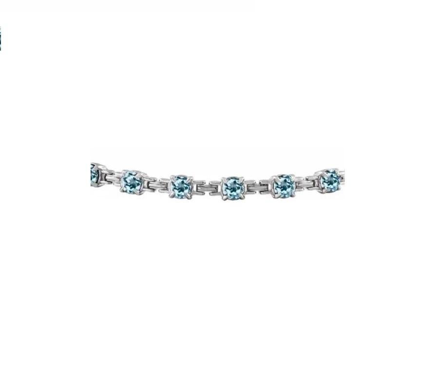 This beautiful line bracelet comes in 14 Karat White Gold and all-natural sky-blue topaz. A perfect match for our sky-blue topaz stud earrings. Simple, Charming, and Chic design. 