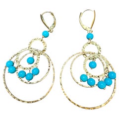 Orecchini pendenti semplici "Natural Sleeping Beauty" in oro giallo 14 carati
