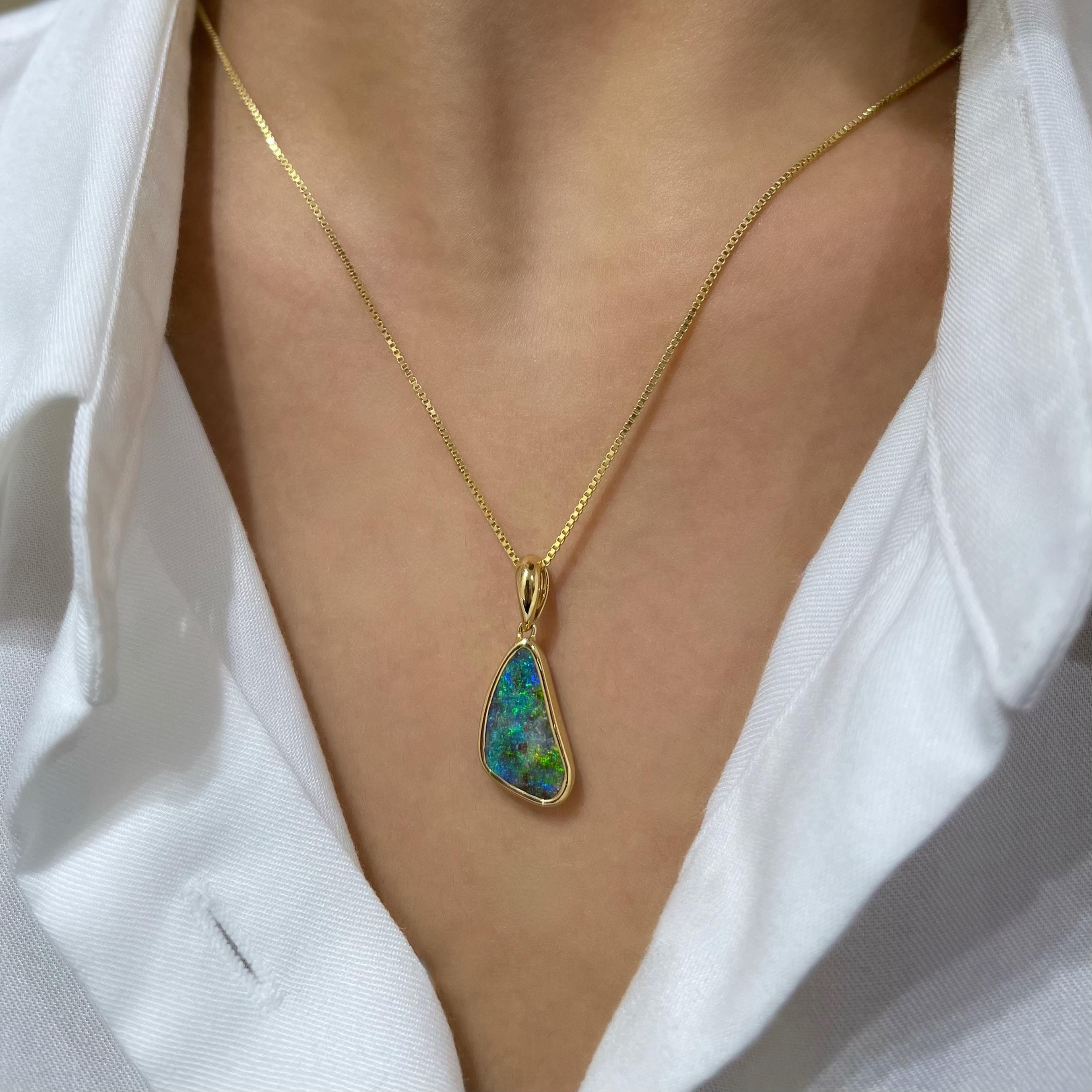 The “You and Me” opal pendant features a precious boulder opal (3.91ct) with a striking design, sourced from Winton, Australia. Set in our glamorous 18K yellow gold, the captivating hues of green, blue and yellow send out a message of companionship