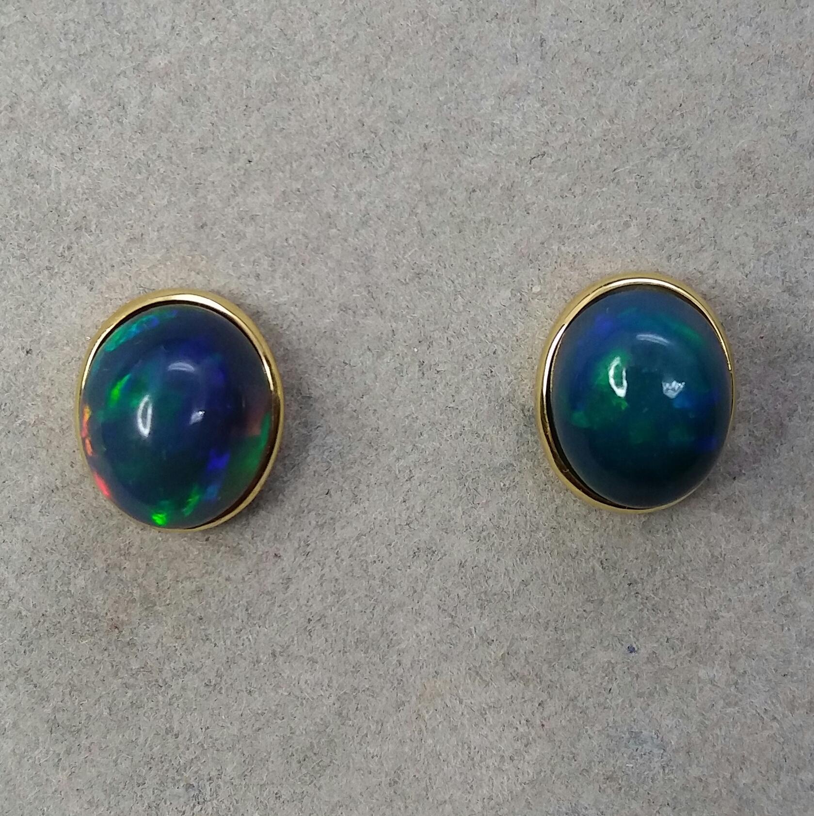 Contemporary Natural Solid Black Opal Oval Cabs 14 Karat Yellow Gold Stud Earrings For Sale