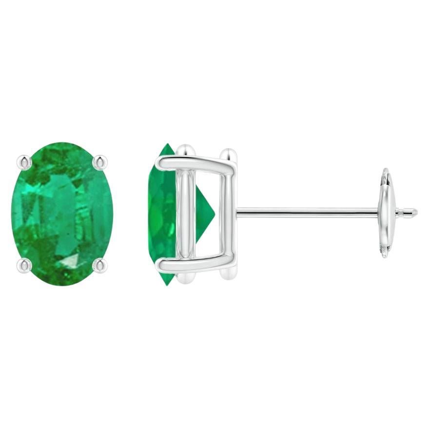 Natural Solitaire Oval Emerald Stud Earrings in 14K White Gold (7x5mm) For Sale