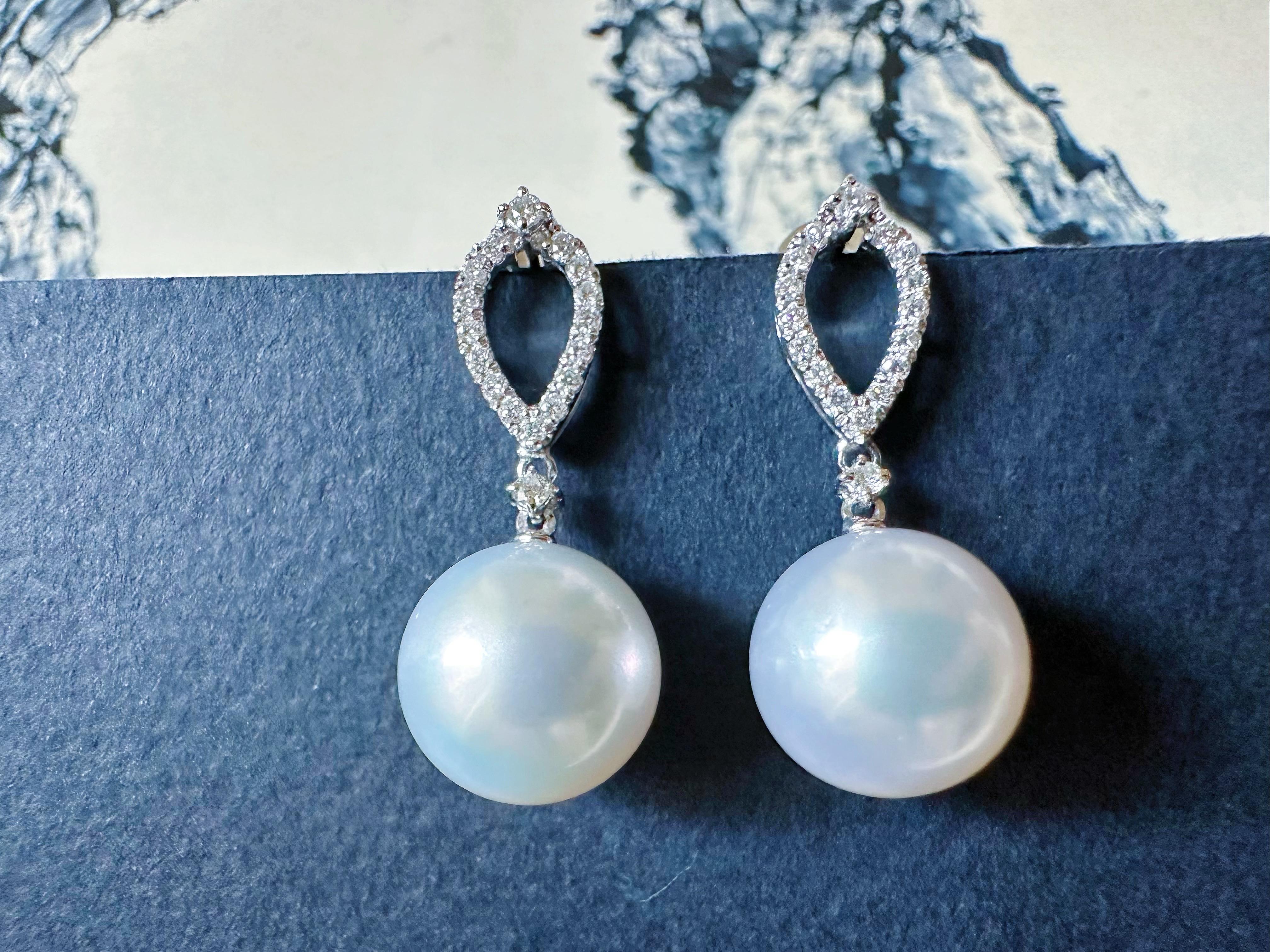Elevate your elegance with our handmade South Sea pearl drop earrings, crafted in 18K white gold and adorned with exquisite diamond accents. This classic design ensures timeless beauty that lasts a lifetime.

Each pearl is unique, showcasing the
