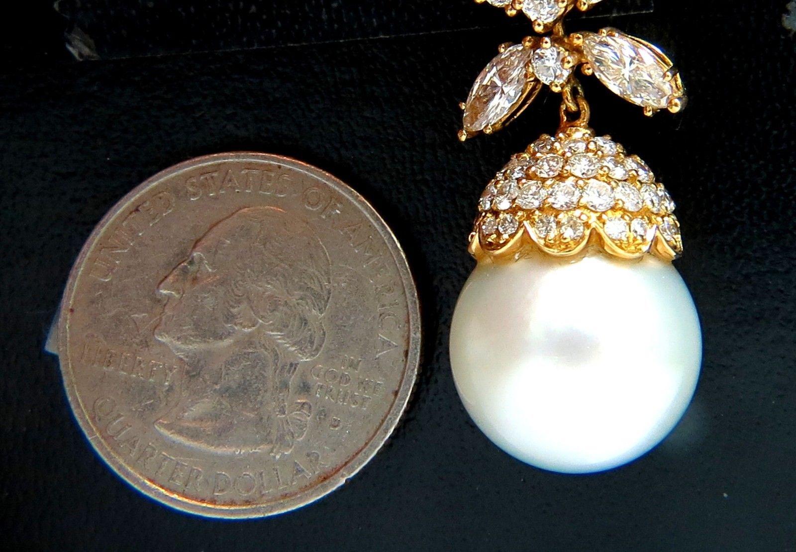 Drop Dangle.

15.6mm natural South Seas Pearls,

White luster, Prime AAA

7.50ct. Natural diamonds  

Marquise & Rounds, Full cut brilliants.

G- color Vs-2 Clarity. 

Secure Lever Backs

Excellent detail.

18kt. yellow gold

Pearls within pretty