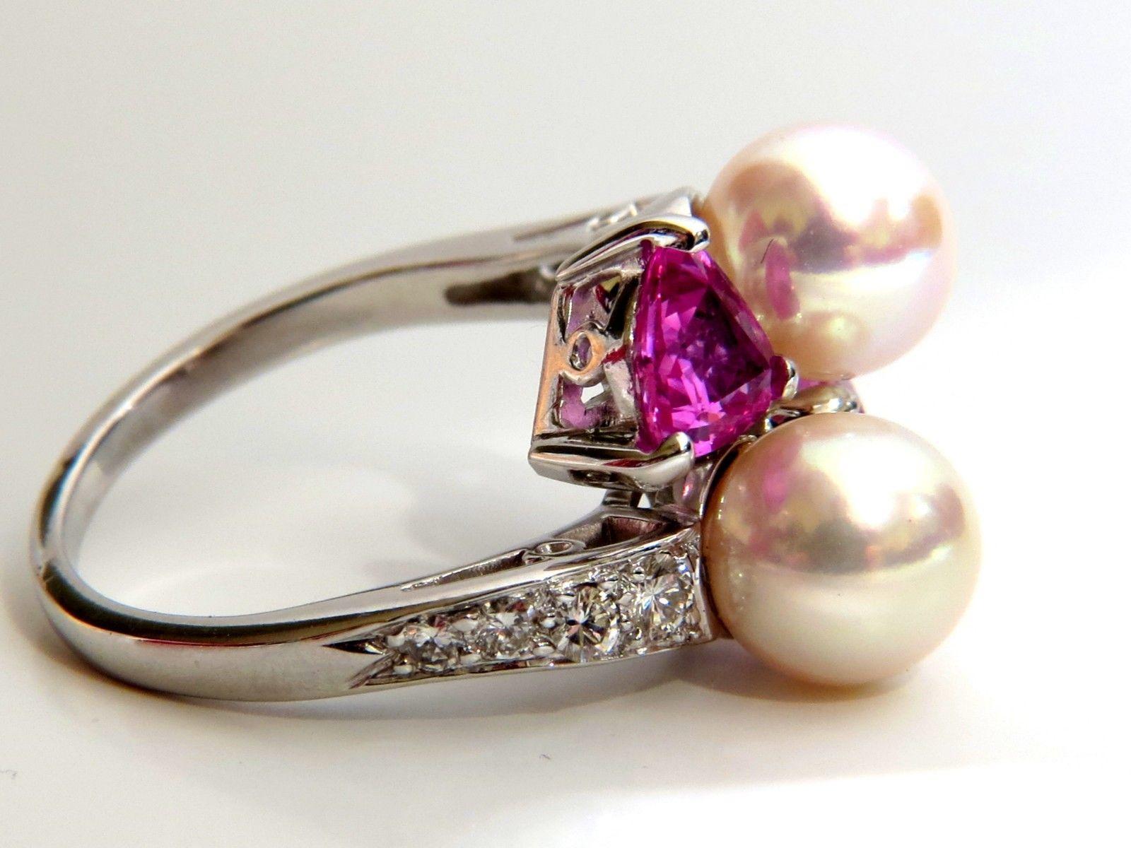 Pearl Cocktail Mod Deco

7.8mm natural South Seas pearl ring

Excellent AAA Quality

Natural Pink Sapphires: 2.20ct

.50ct round diamonds. 

G-color Vs-2 clarity.

Platinum

8.8 grams.

Current ring size: 7.25

We may resize, Please inquire.
