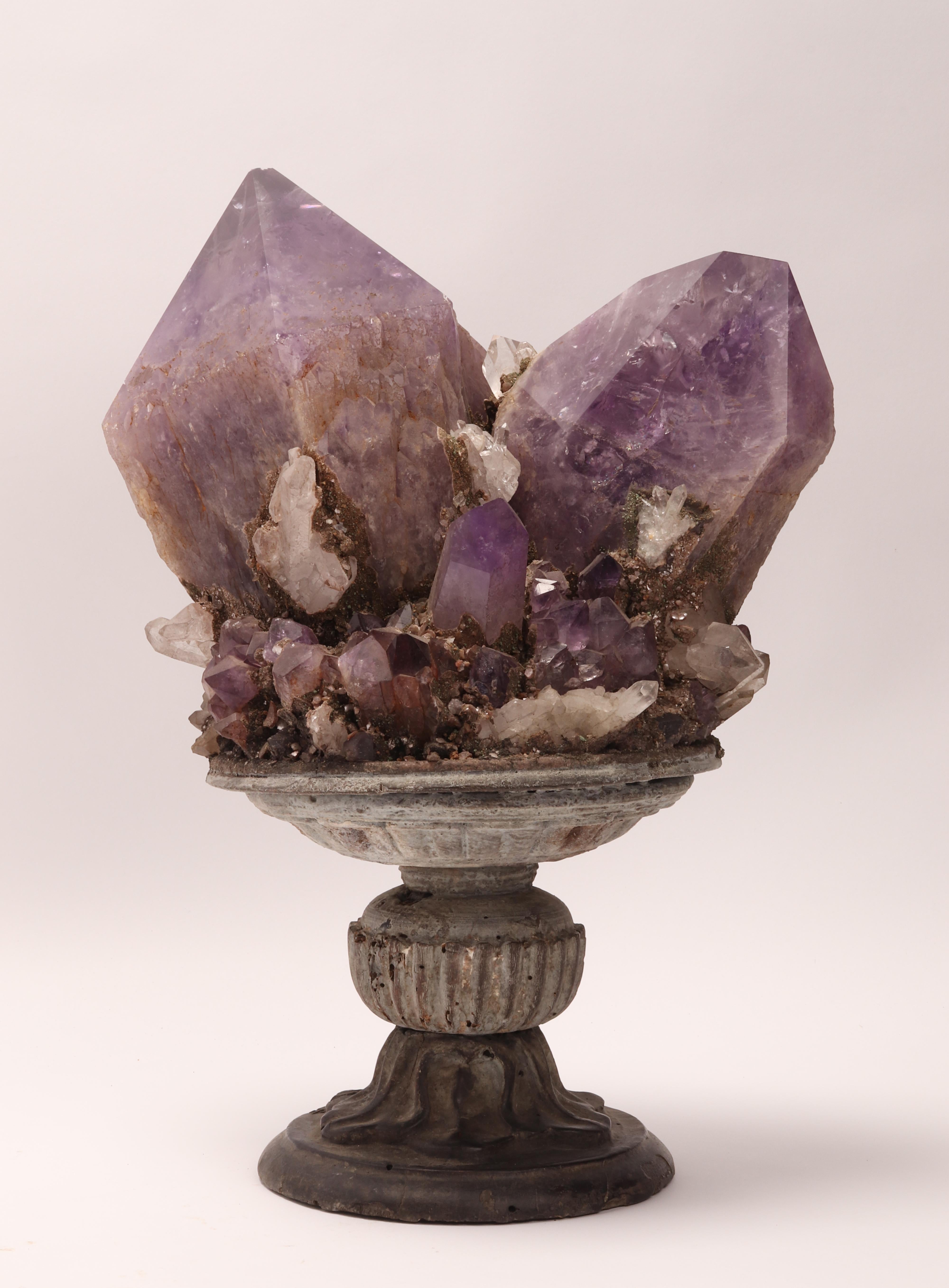 Naturalia mineral specimen. A druse of amethyst and quartz crystals, mounted over a wooden base on a vase shape. Italy 1880 ca.