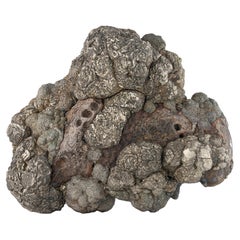 Spécimen naturel de pyrite dorée sur limonite provenant du Pakistan