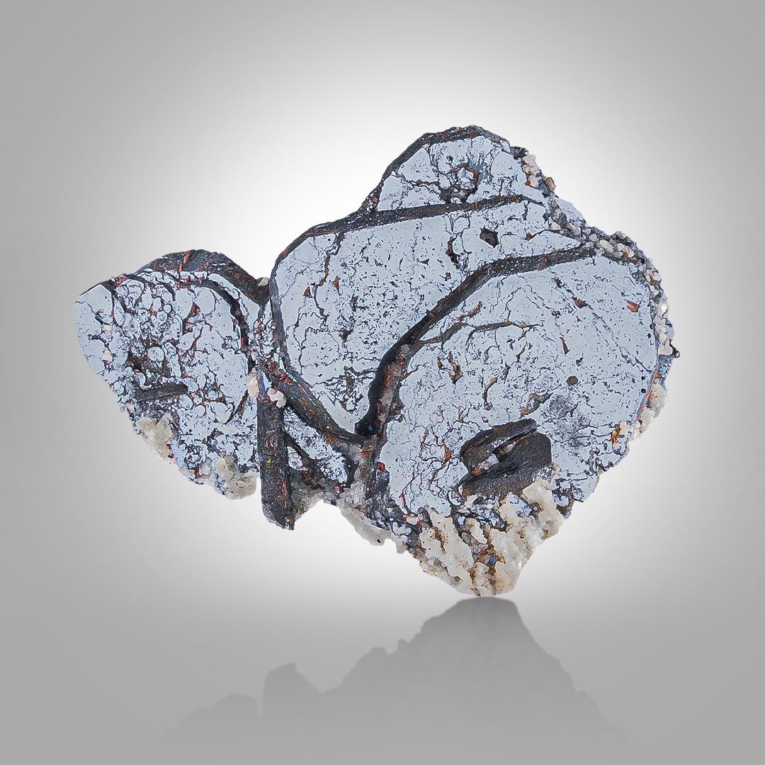 Specimen Type: Hematite with Sagenite 
Weight: 192 grams
Dimension: H: 7.8 x W: 9.5 x D: 5 cm 
Origin: Tormiq Valley, Skardu District, Gilgit Baltistan Province, Pakistan 
Treatment: None




This natural specimen features shimmering silver hematite