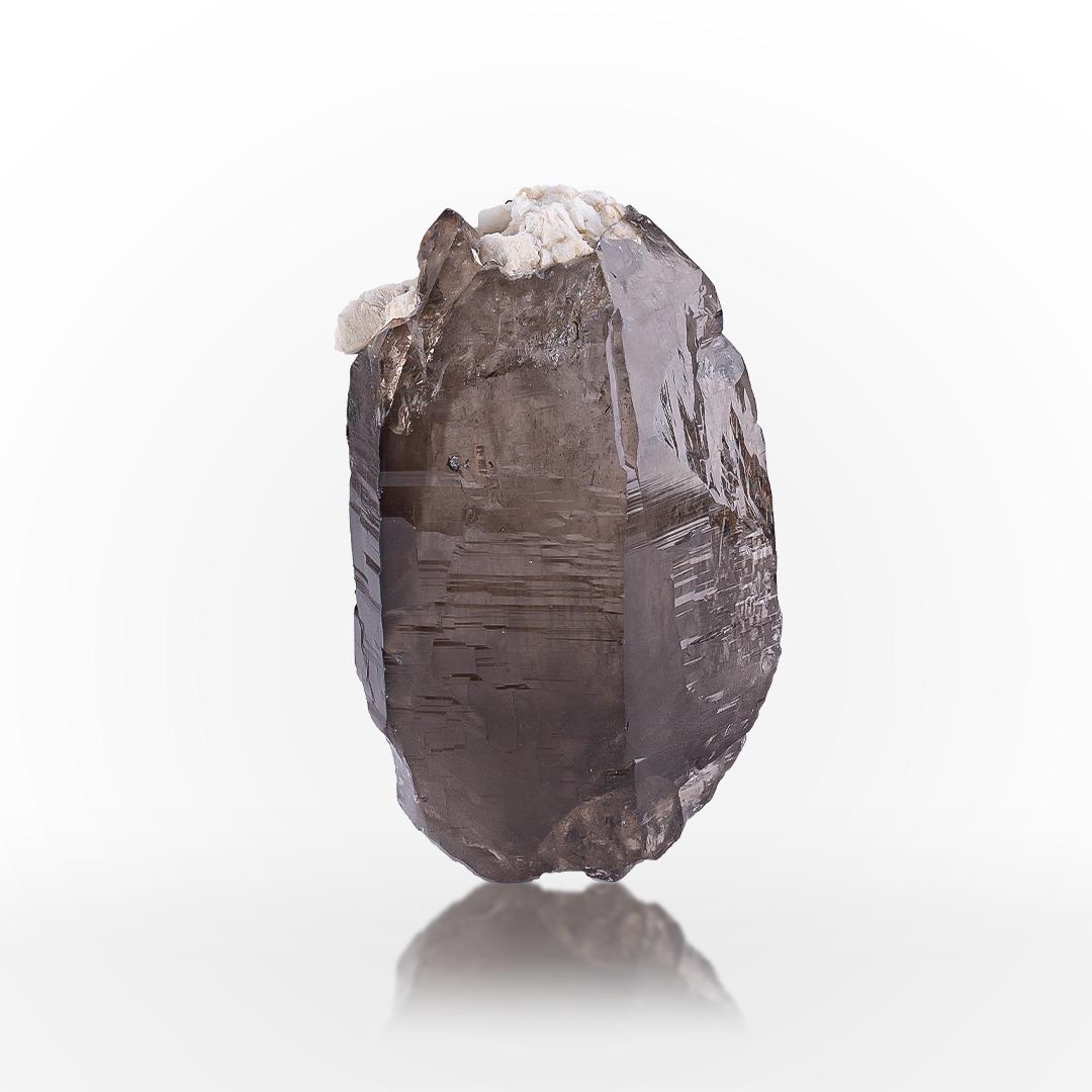 Specimen Type: Smoky Quartz
Weight: 432 grams
Dimension: H: 10.5 x W: 6.3 x D: 4.8 cm
Origin: Skardu District, Gilgit Baltistan Province, Pakistan 
Treatment: None




This natural specimen of Smoky Quartz originates from the high-altitude mineral