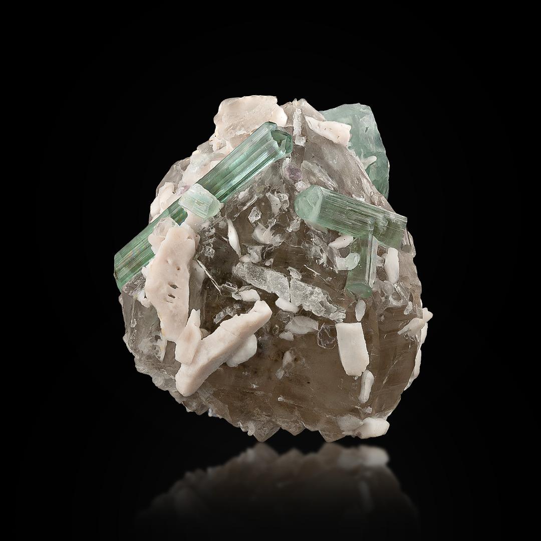 Specimen Type: Tourmaline on Smoky Quartz 
Weight: 93 grams
Dimension: H: 5.2 x W: 5 x D: 3.5 cm 
Origin: Dara I Pech, Chappa Dara District, Kunnar Province, Afghanistan
Treatment: None




This natural specimen features beautifully formed