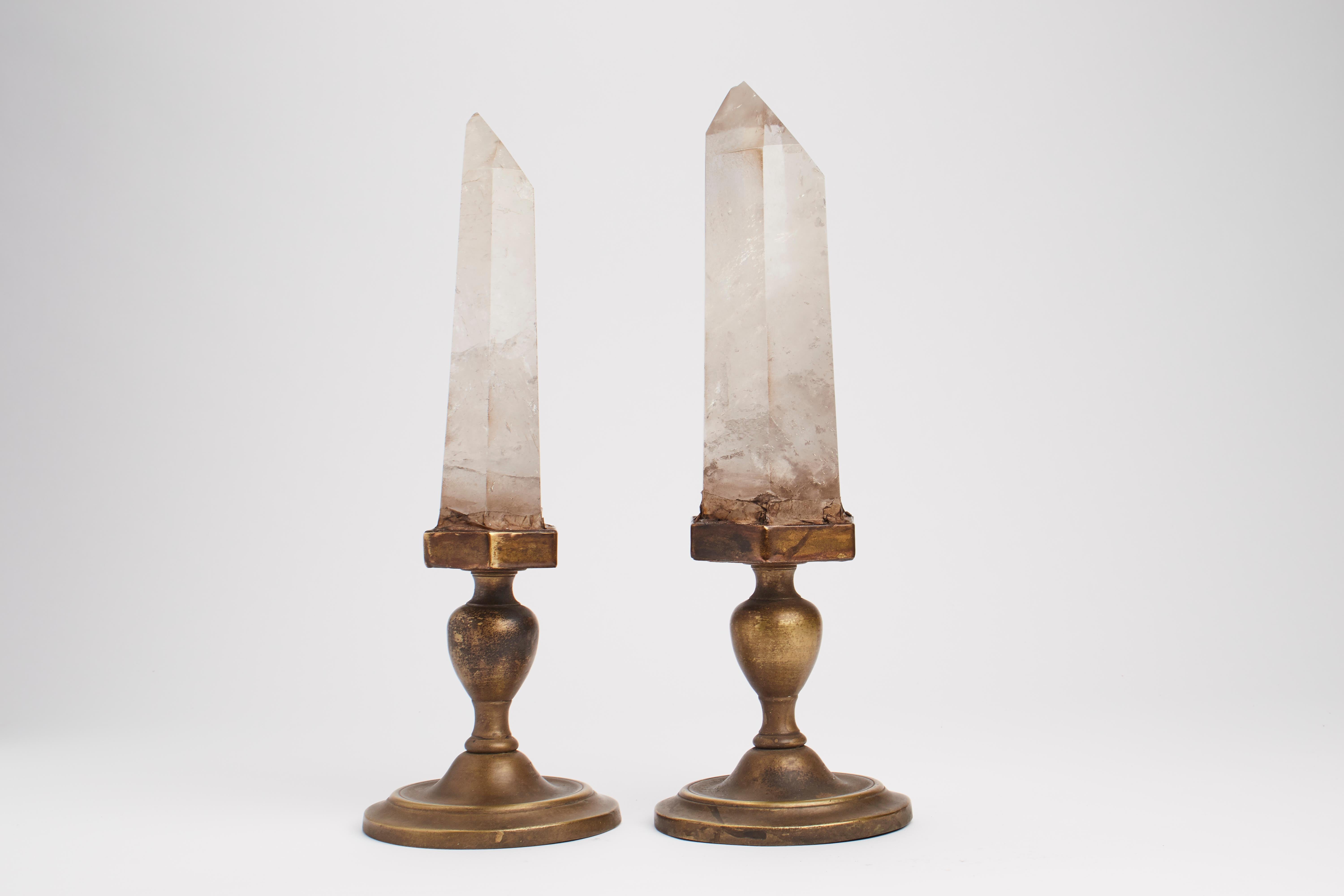 A natural mineral specimen for Wunderkammer: a pair of big rock crystals quartz mounted on a brass base. Italy 1880 ca.