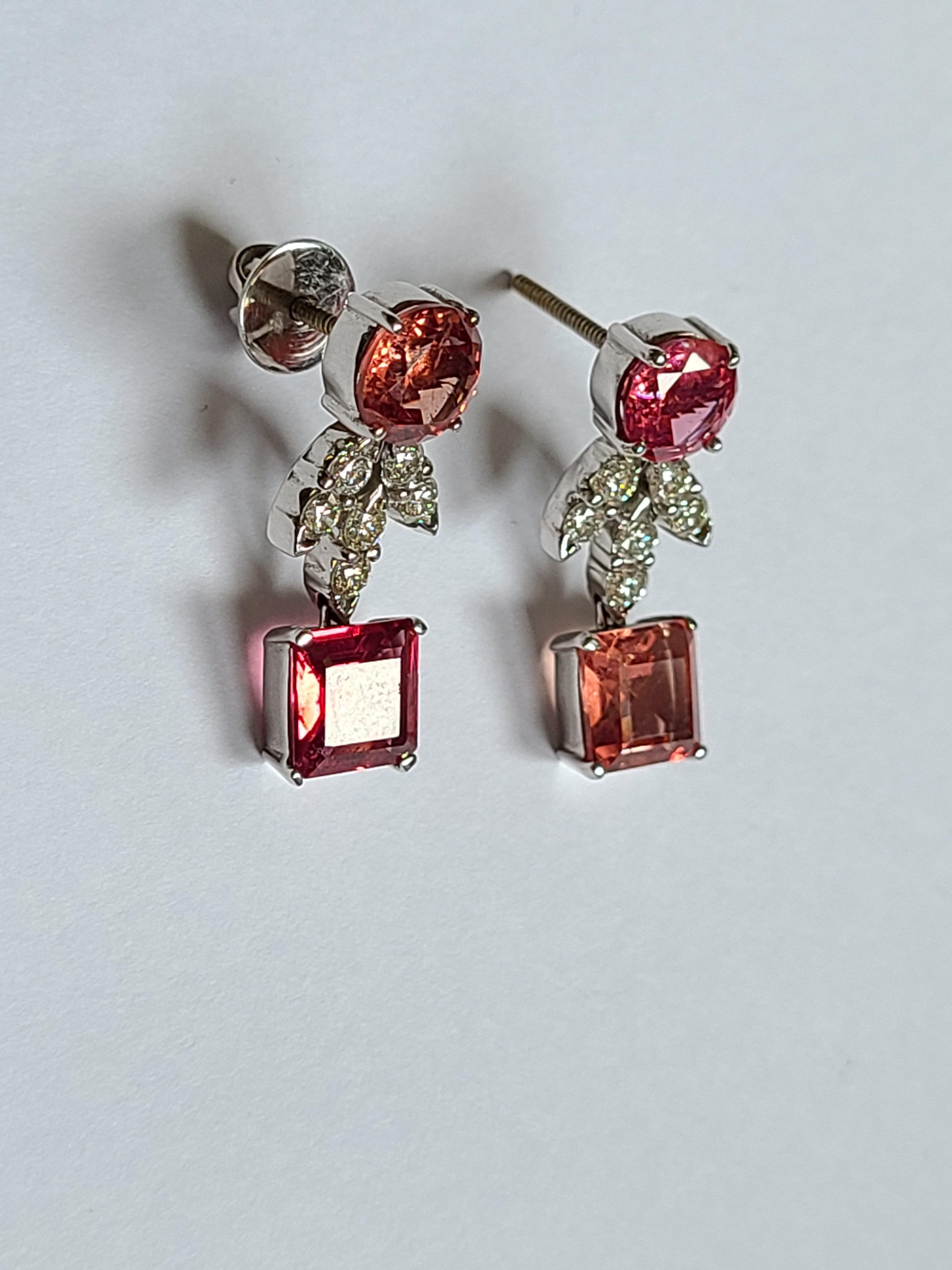 A beautiful Spinel earrings with diamonds set in 18k gold with diamonds. The spinel weight is 7.71 carats and diamond weight is .76 carts. The earring dimension in cm 2.4 x .4 x .4 (LXWXH).