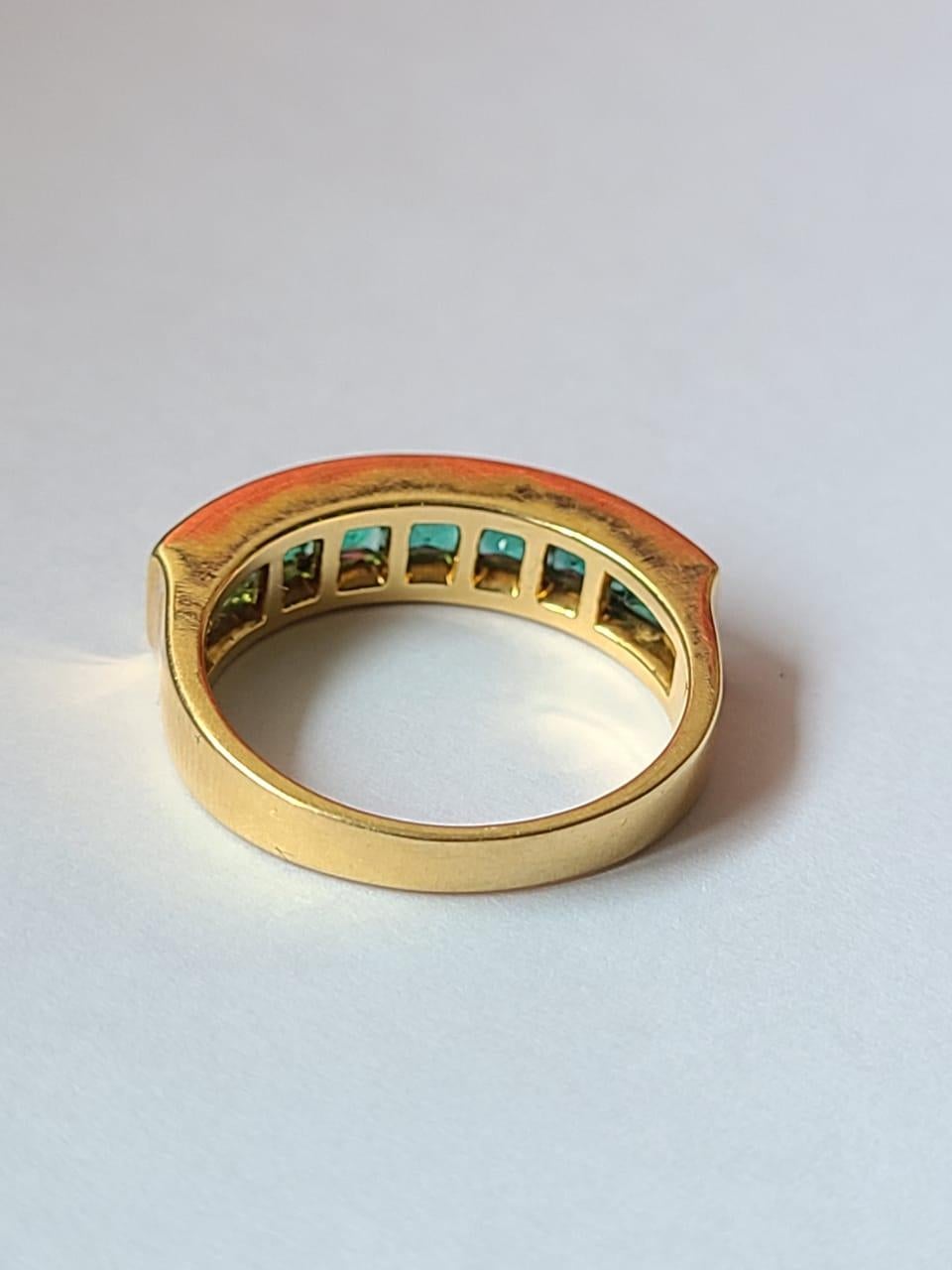 A very gorgeous and chic, Zambian Emerald Band/ Wedding Ring set in 18K Yellow Gold. The weight of the Square cut Emeralds are 1.42 carats. The Emeralds are completely natural, without any treatment & is of Zambian origin. Net Gold weight is 5.67