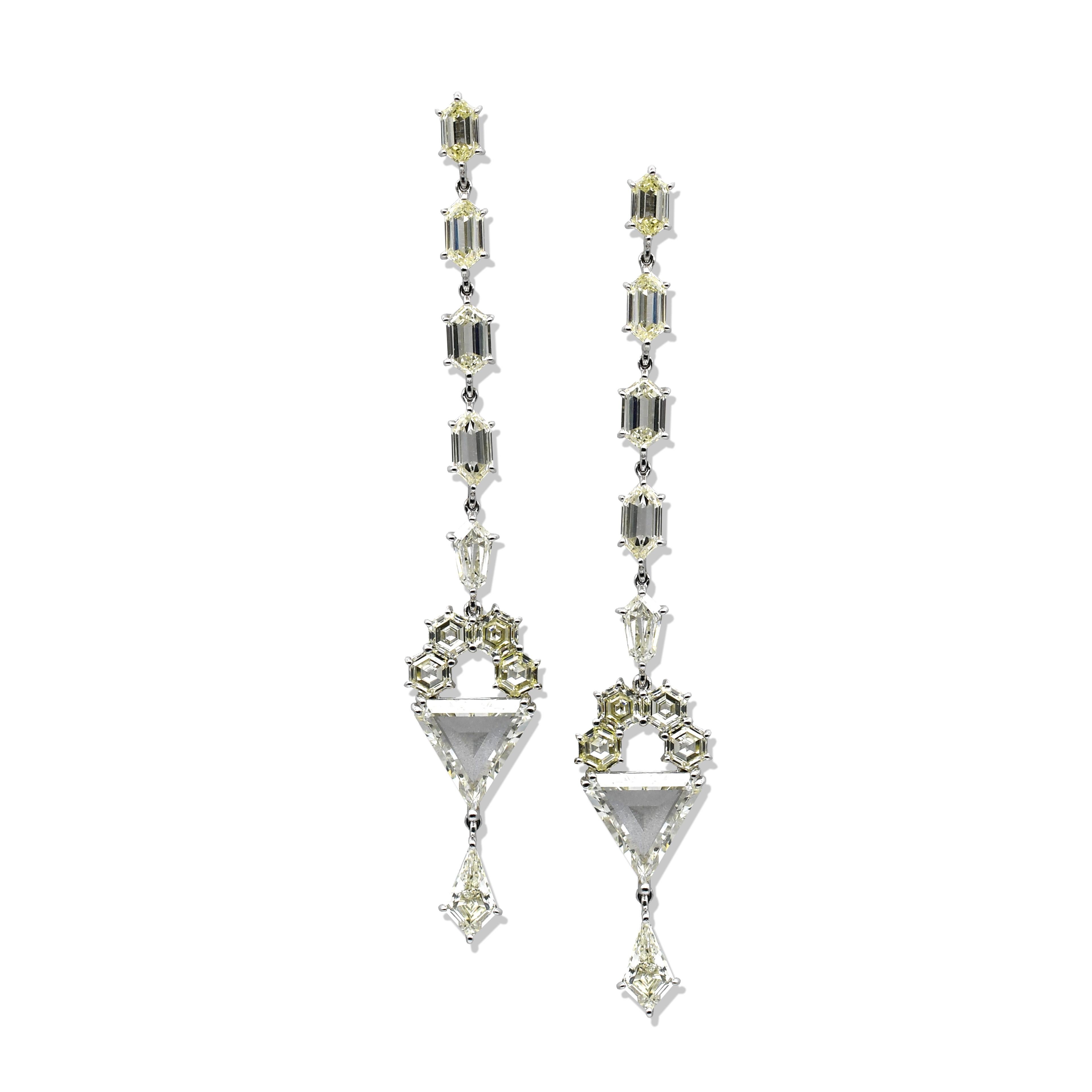 This Classic Chandelier Fancy Diamond Earring contains total 22 Pieces of Stepcut Triangles, Hexagons and Spike Diamonds totaling 11.24 Carats Beautifully Crafted in 8.27 Gram 18 Karat White Gold. It is 7 Centimeter Long From Top to Bottom.
All