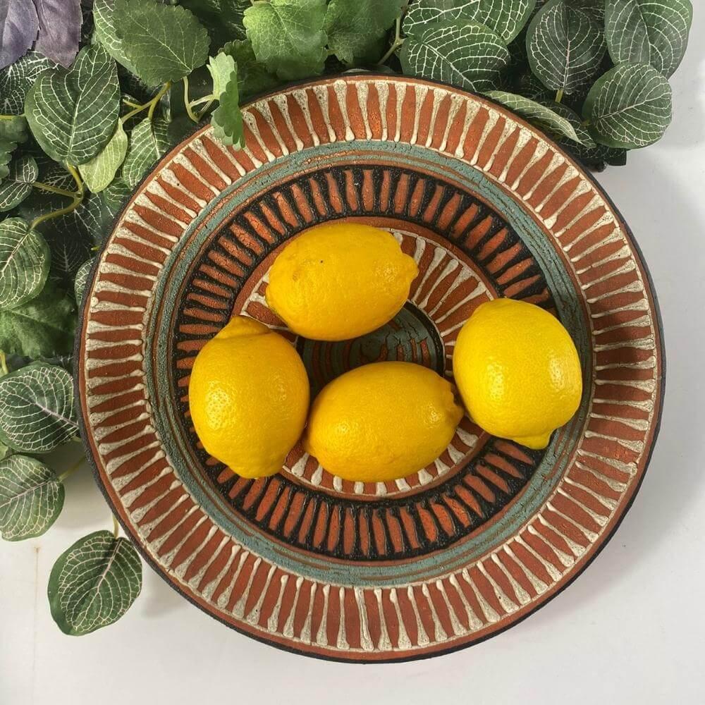 Organic, natural-looking fruit bowl from the period 1960 France. A large, exciting earthenware bowl decorated with handmade pastel lines in pastel green, white, and black colors. Marked.