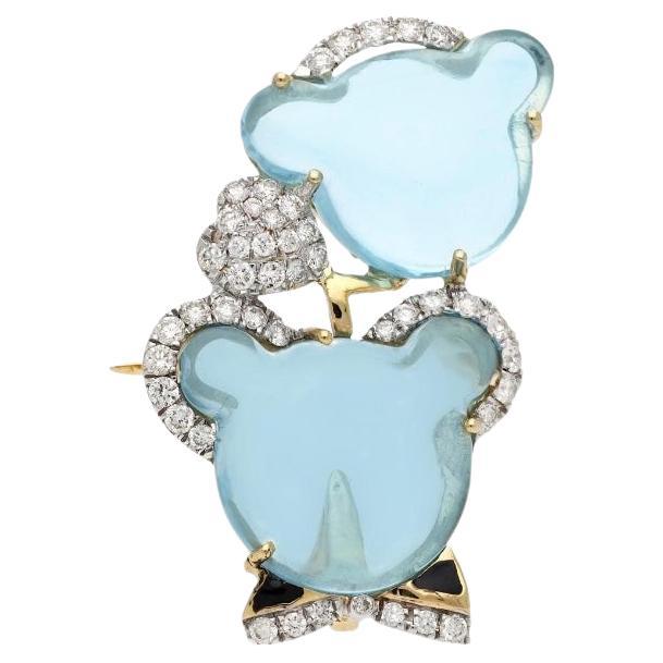 Broche de diamantes con topacio azul suizo natural en oro de 18 quilates