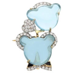 Natural swiss blue topaz diamond brooch in 18k gold