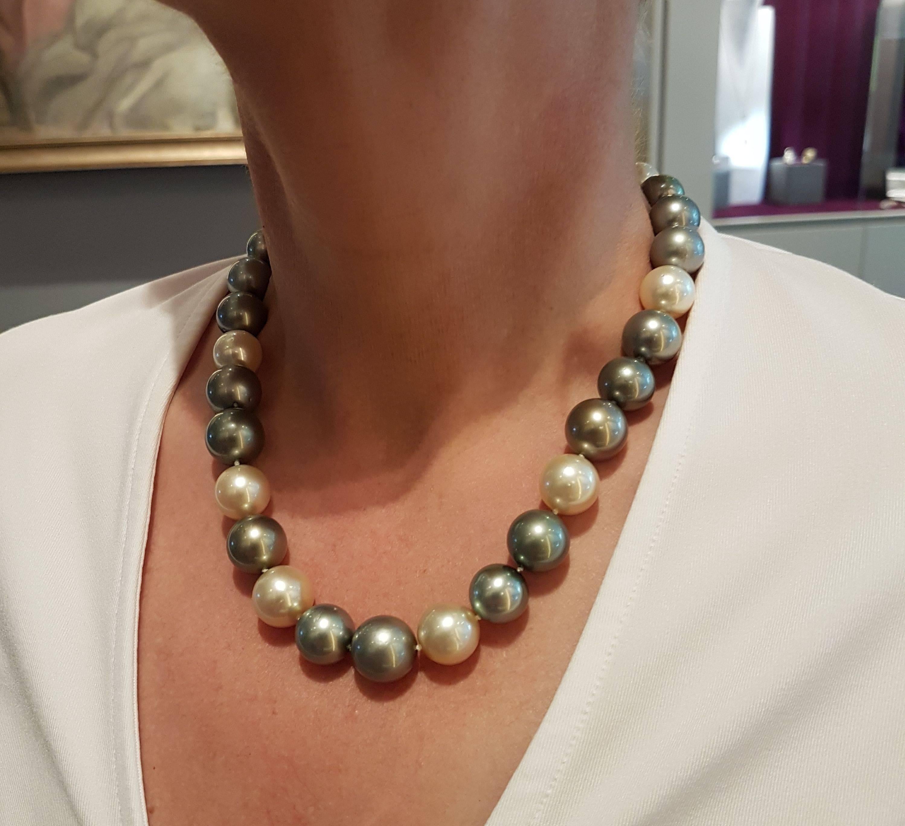 Adorable pearl necklace made of finely matched natural Tahiti and South Sea pearls 12,3 - 14,7 mm with an excellent luster. Natural colors beautifully matched, green, grey, vanilla, cream, brown. Unusual, elegant yet pure and simple. 
Bajonet catch,