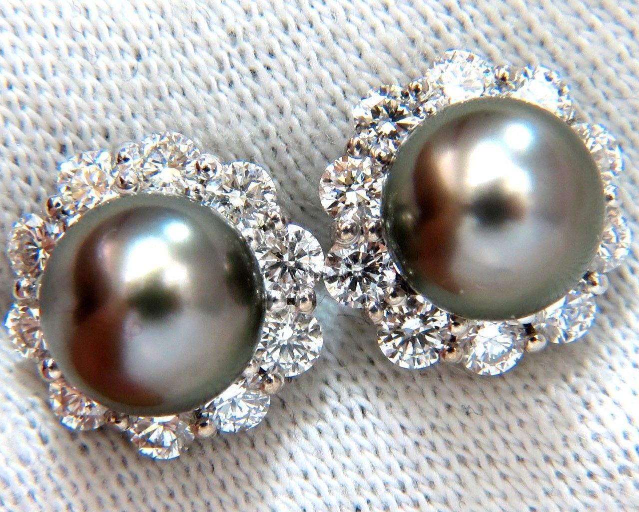 Pearl Cluster Halo.

8.5mm natural Tahitian Black Pearls,

Pinctada Mollusk, Black Lipped Oyster

 Dark Grey luster with slight pinkish overtone 

1.80ct. Natural diamonds  

Round, Full cut brilliants.

G- color Vs-2 Clarity. 

Secure Lever 

Made