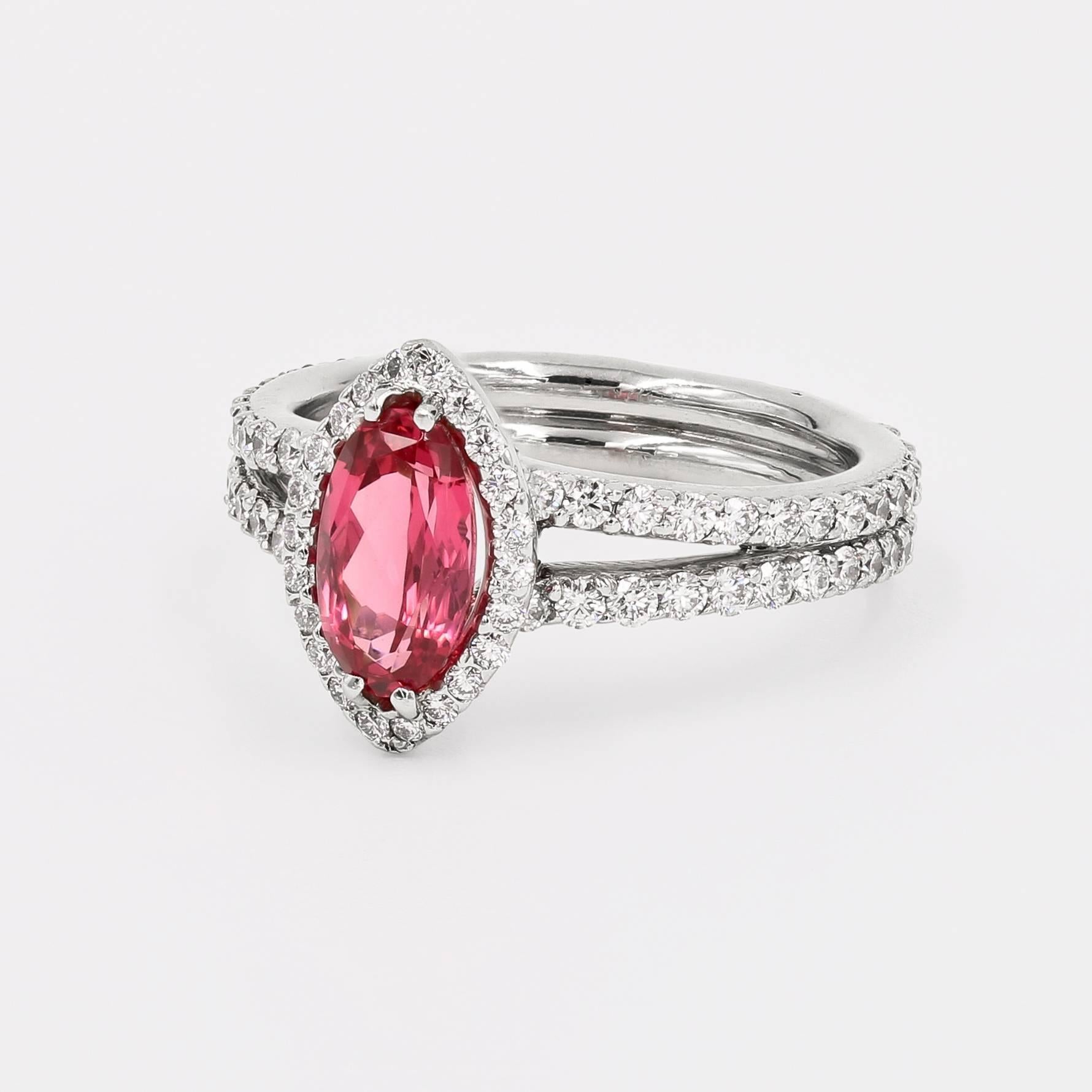 This elegant platinum ring contains a center 1.22cts. oval vivid pink spinel from Tanzania. Around the center and the entire shank are 110 ideal cut round diamonds=  1.12cts. t.w. (diamonds are G/VS)

Finger size is a 6, but can be sized to