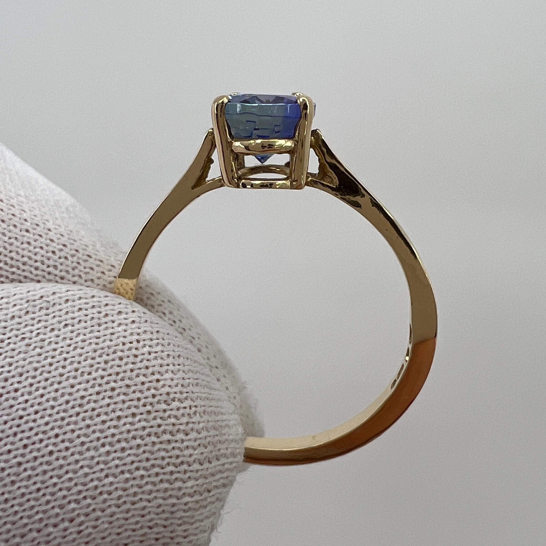 Tanzanita natural 1,34ct Azul vívido Violeta talla oval Anillo solitario de oro amarillo en venta 3