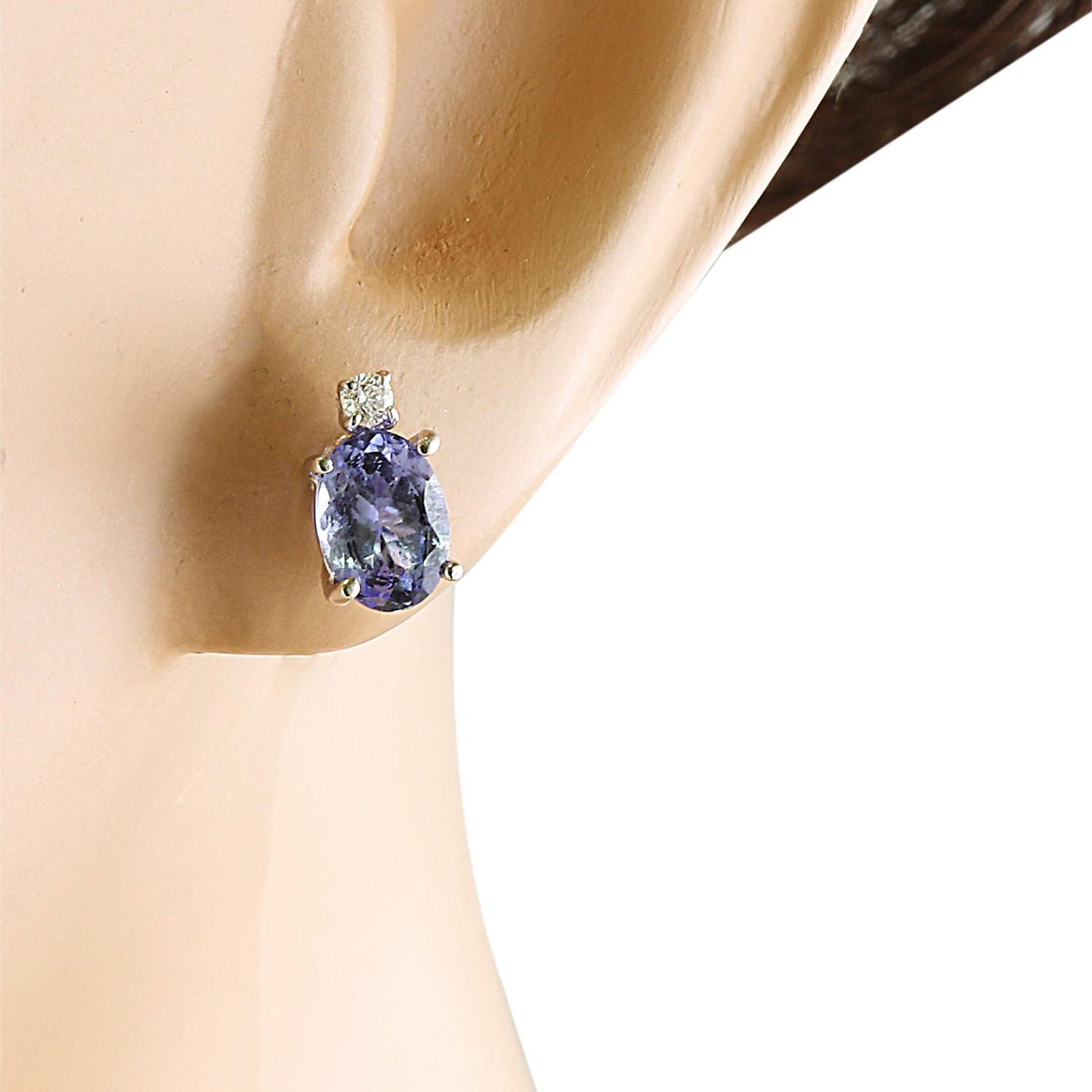 3.26 Carat Natural Tanzanite 14 Karat Solid White Gold Diamond Earrings
Stamped: 14K 
Total Earrings Weight: 1.6 Grams 
Tanzanite Weight: 3.20 Carat (8.00x6.00 Millimeters)  
Quantity: 2
Diamond Weight: 0.06 Carat (F-G Color, VS2-SI1 Clarity