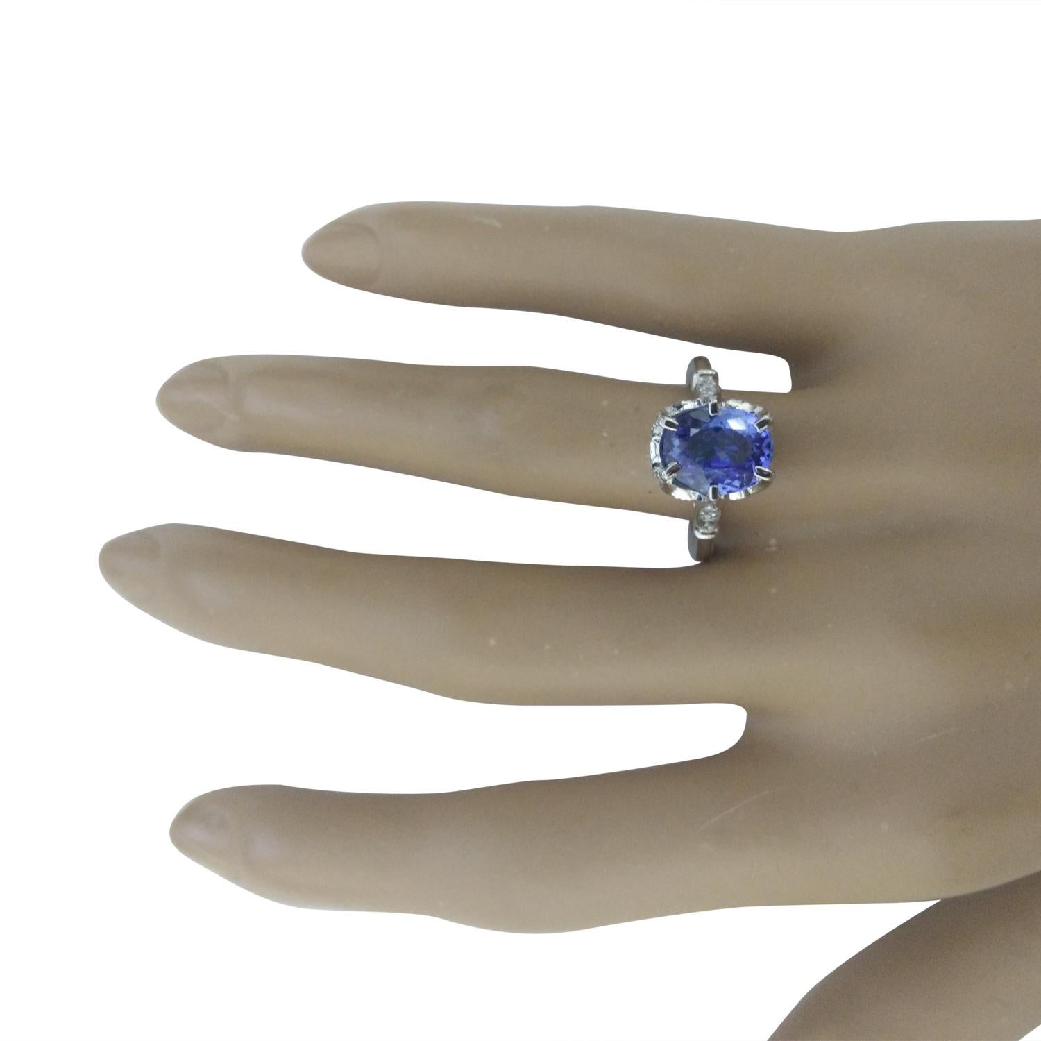 2.69 Carat Natural Tanzanite 14 Karat Solid White Gold Diamond Ring
Stamped: 14K
Total Ring Weight: 2.5 Grams 
Tanzanite Weight: 2.54 Carat (10.00x8.00 Millimeters)  
Diamond Weight: 0.15 Carat (F-G Color, VS2-SI1 Clarity)
Quantity: 4
Face Measures: